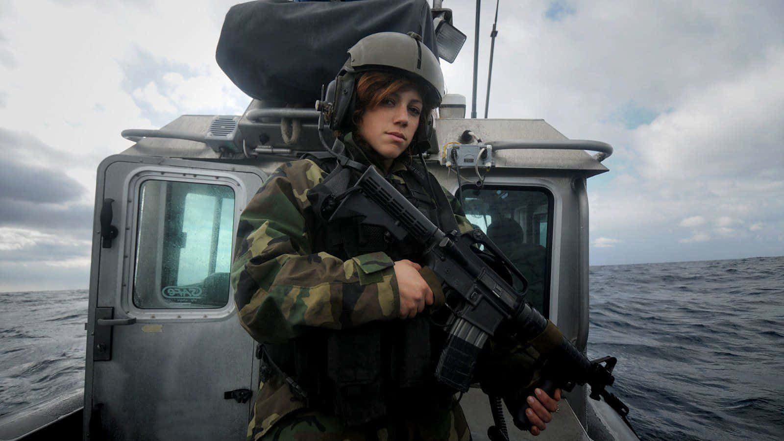 Woman Holding Gun Uniform On Boat Background