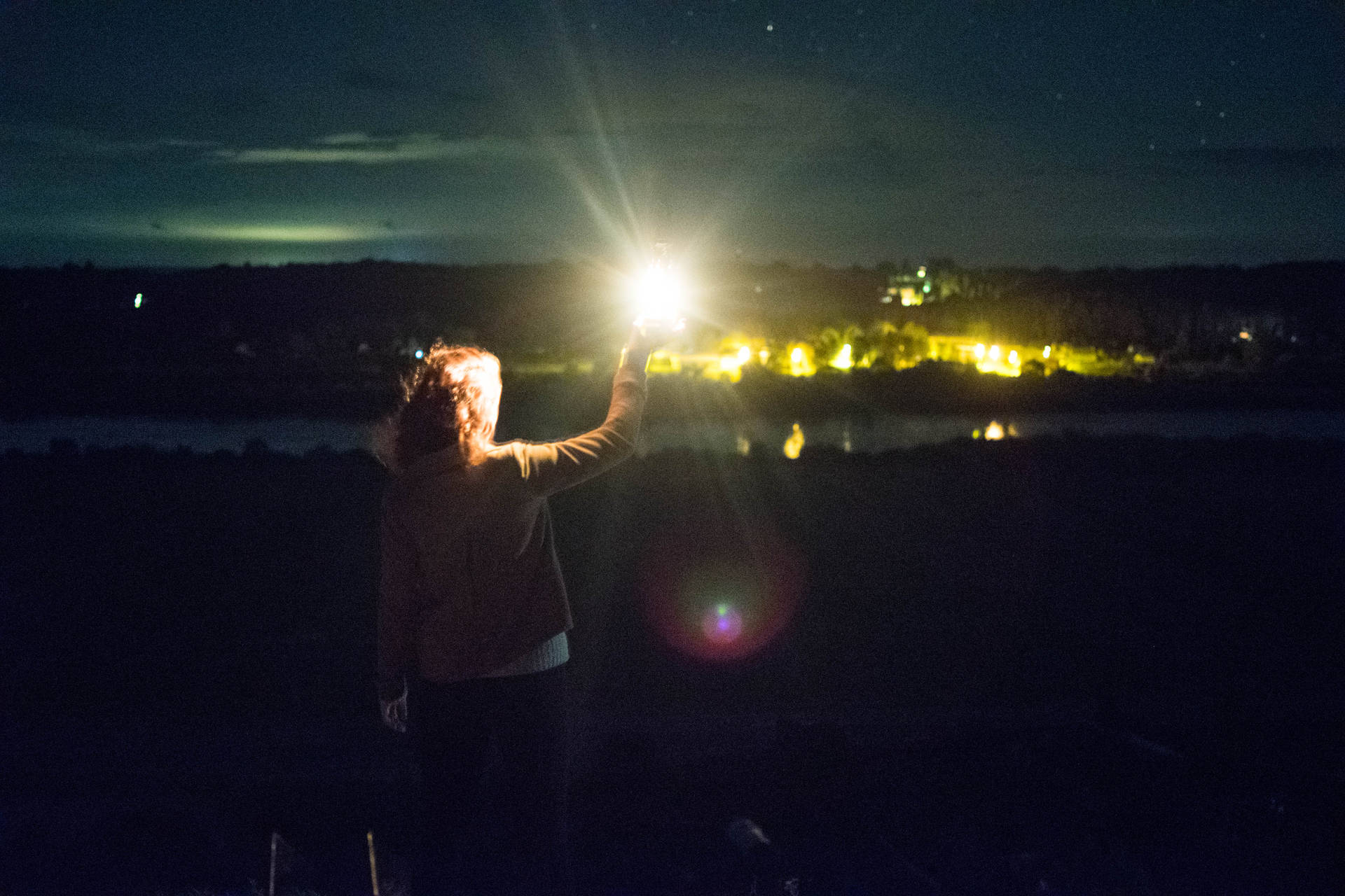 Woman Holding Lantern In Lithuania Background