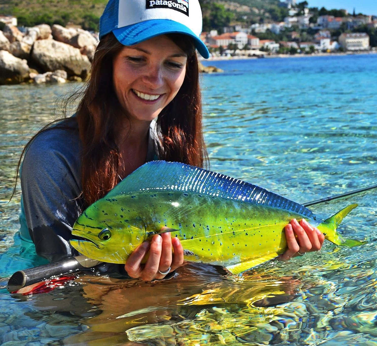 Woman Holding Mahi Mahi Catch Background