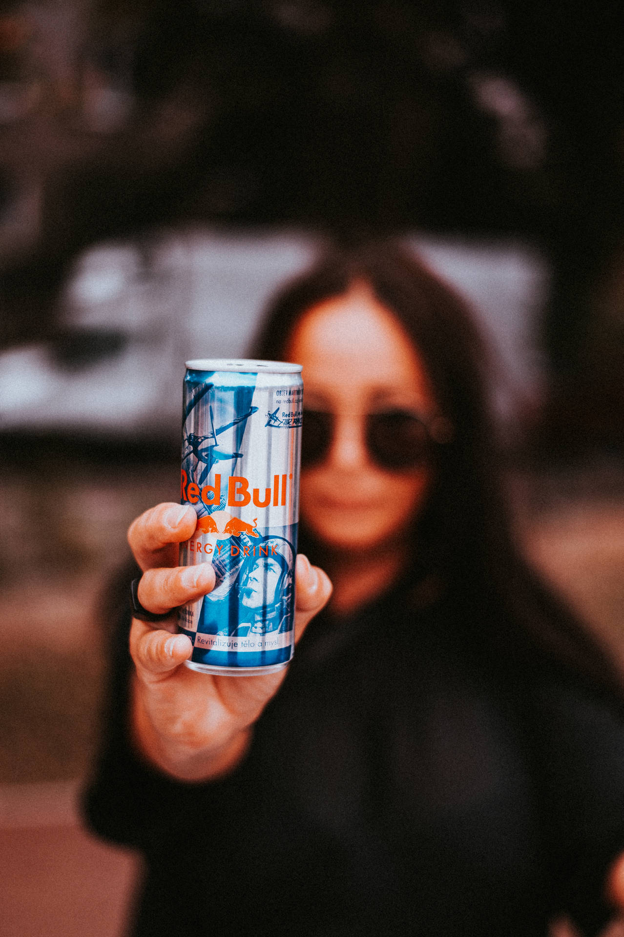 Woman Holding Red Bull