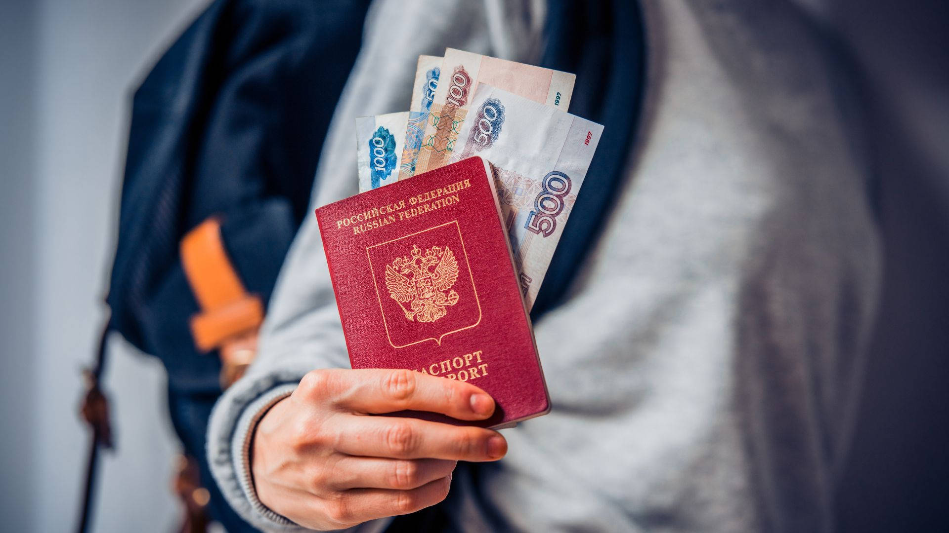 Woman Holding Russian Passport And Banknote Background