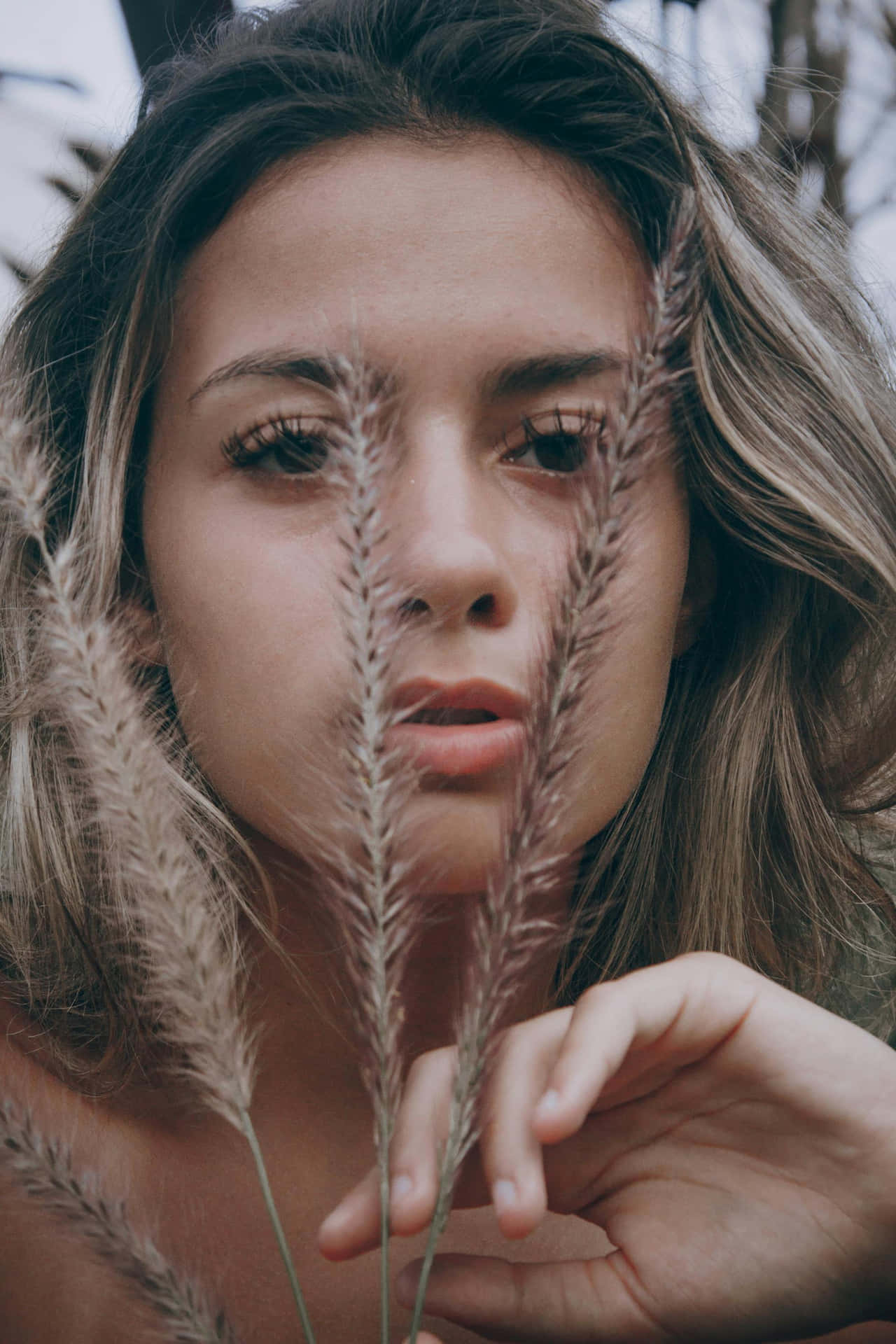 Woman Holding Wheat Grass