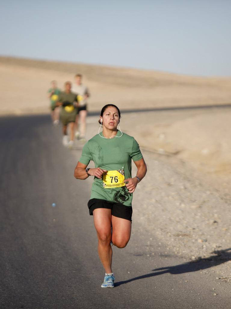 Woman In A Marathon Background