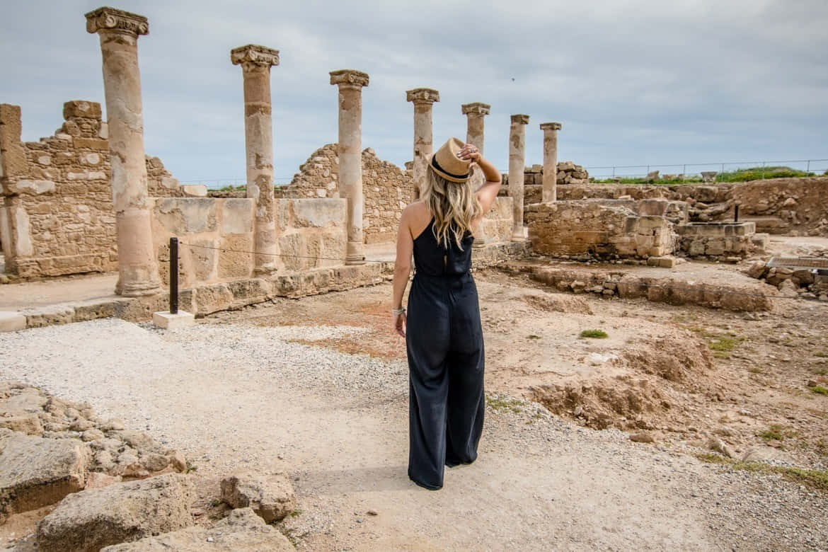 Woman In Archaeological Site Of Nea Paphos Background