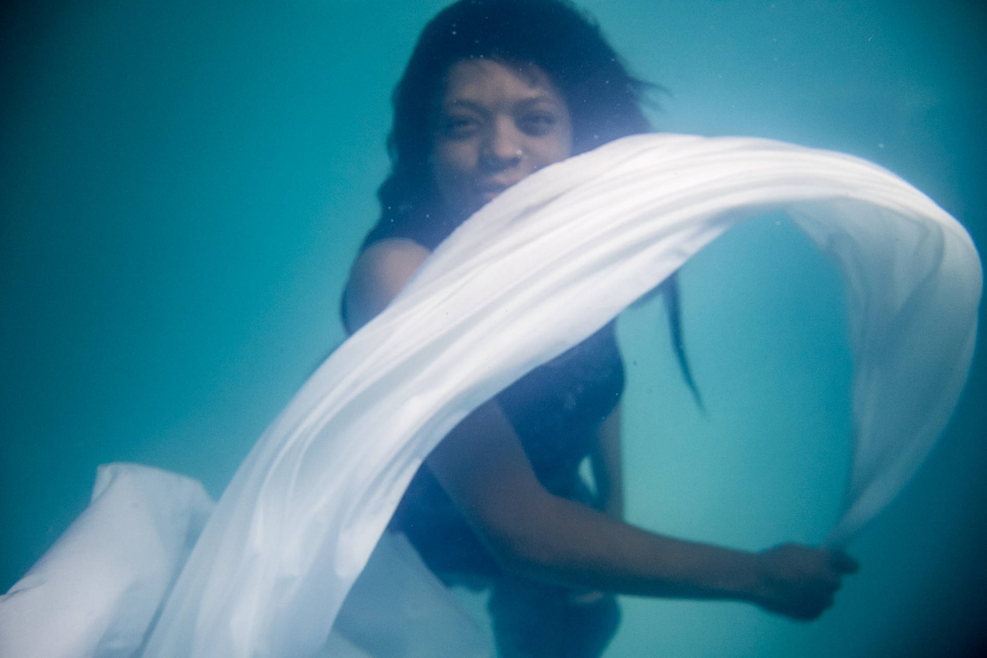 Woman In Beautiful Blue Water