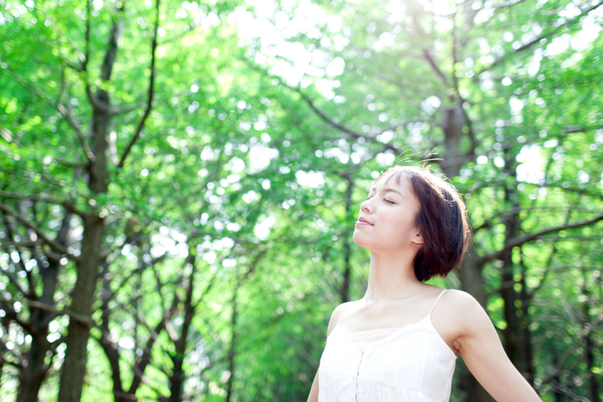 Woman In Forest Breathing Freely Background