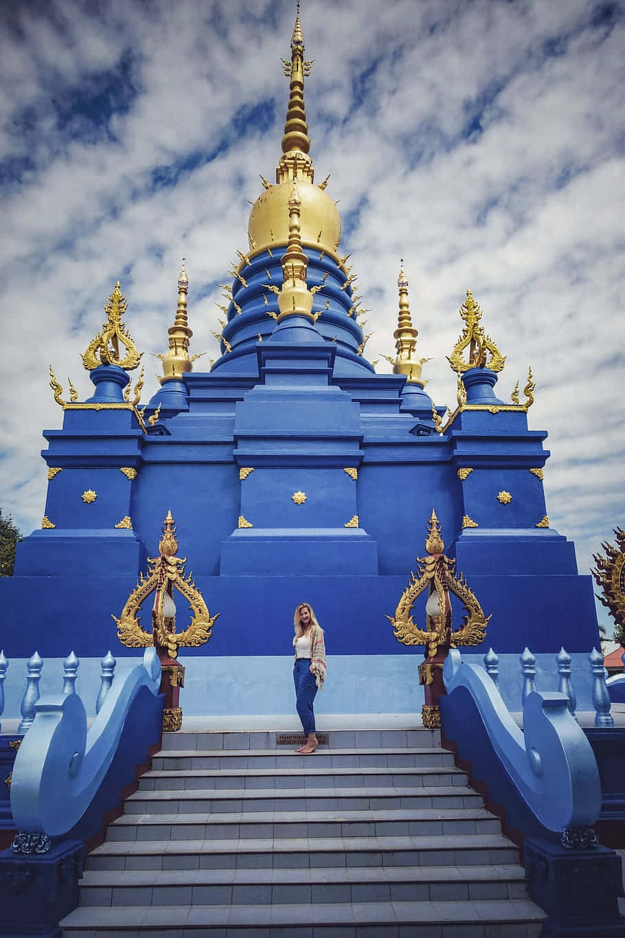 Woman In Front Of The Blue Temple In Chiang Rai Background