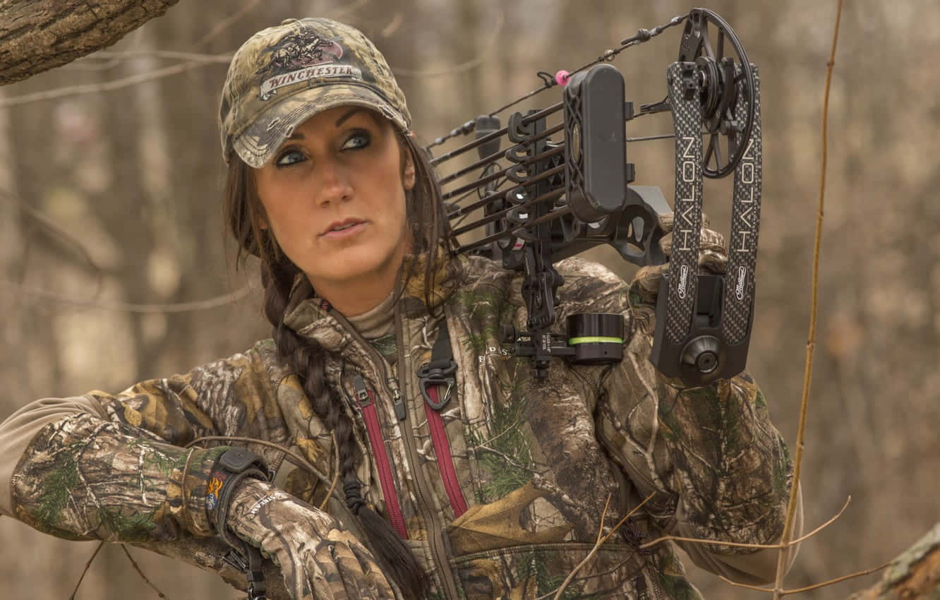 Woman In Hunting Camo With Bow Background