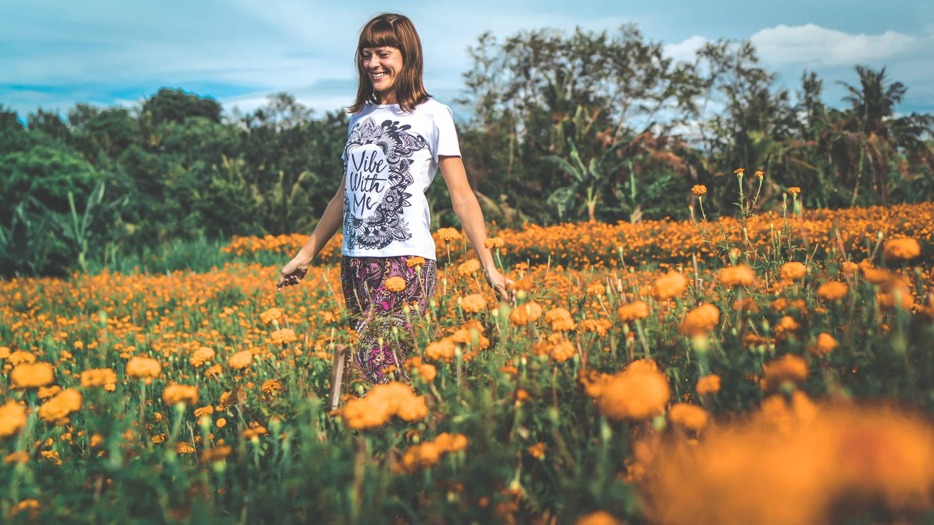 Woman In Marigold Flower Field Background