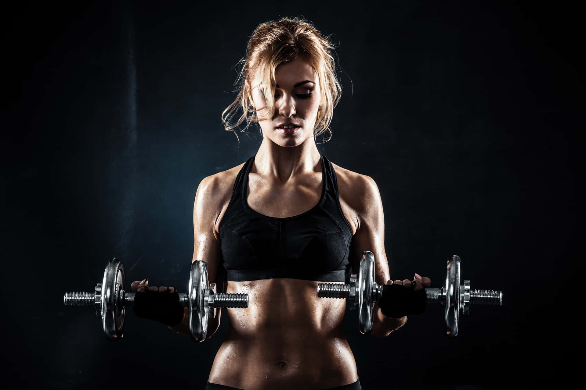 Woman In Sexy Pose With Weights Background