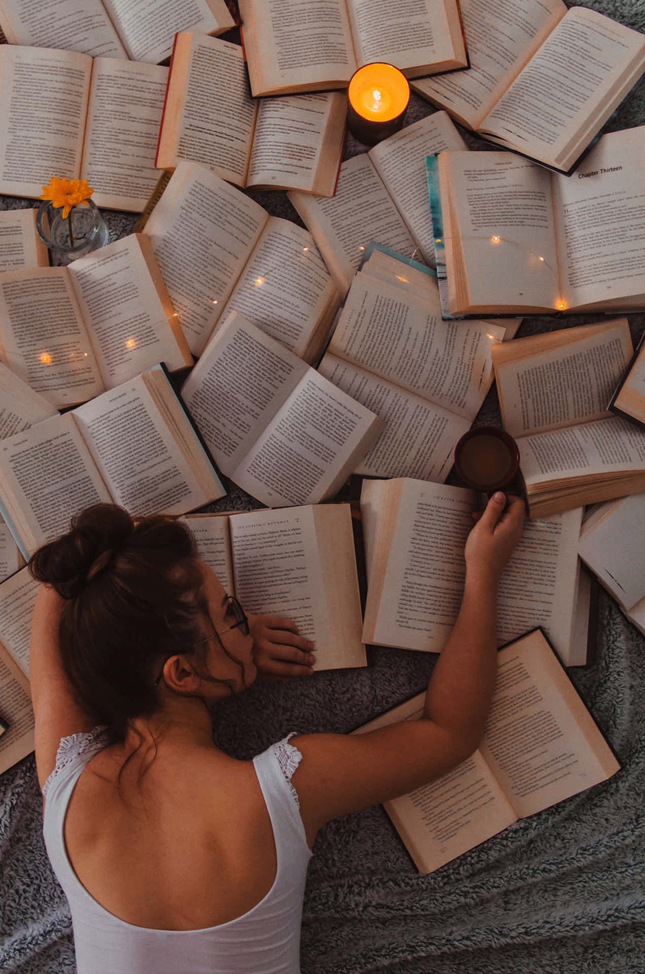 Woman Leaning On A Novel Background