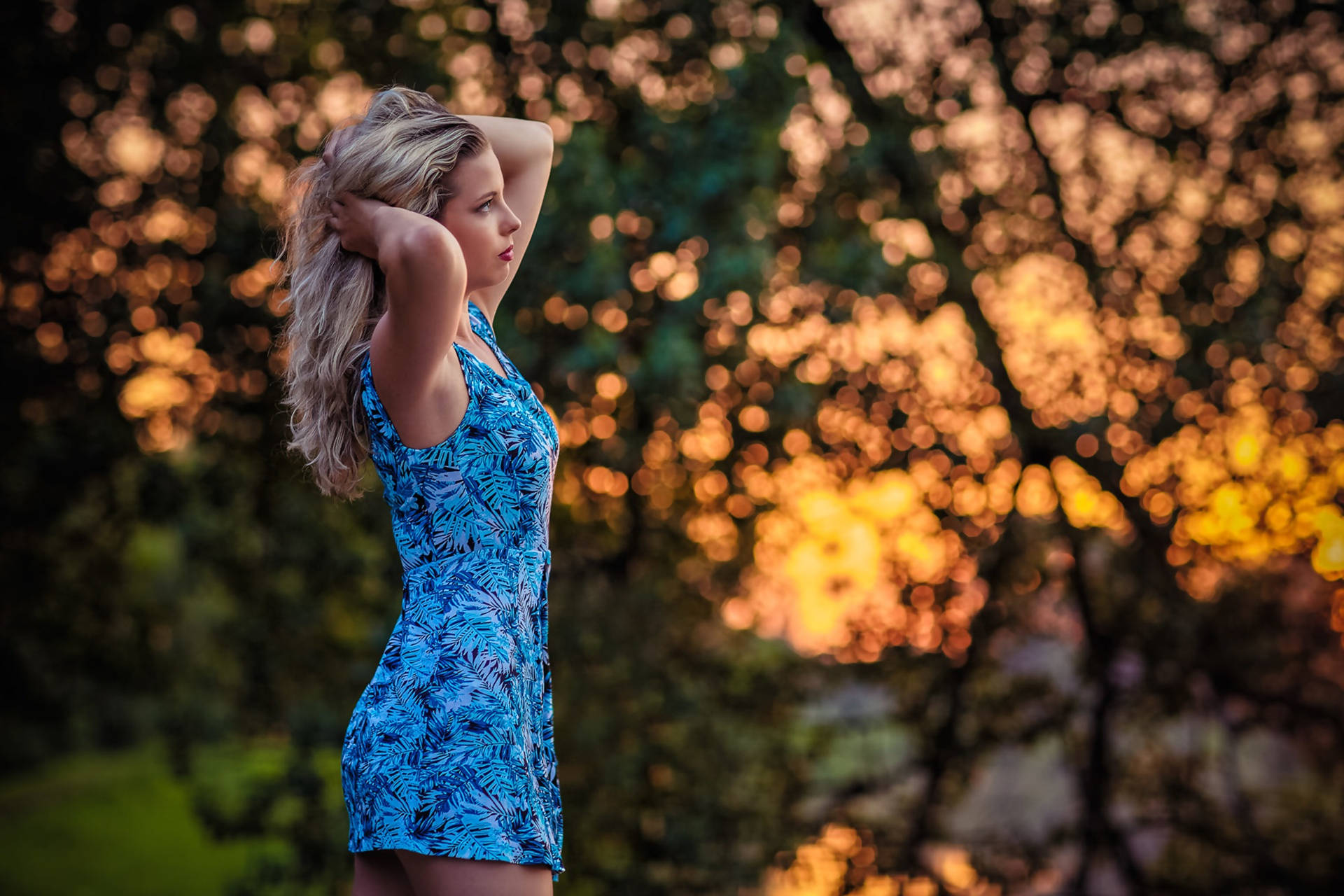 Woman Modelling A Beautiful Blue Dress Background