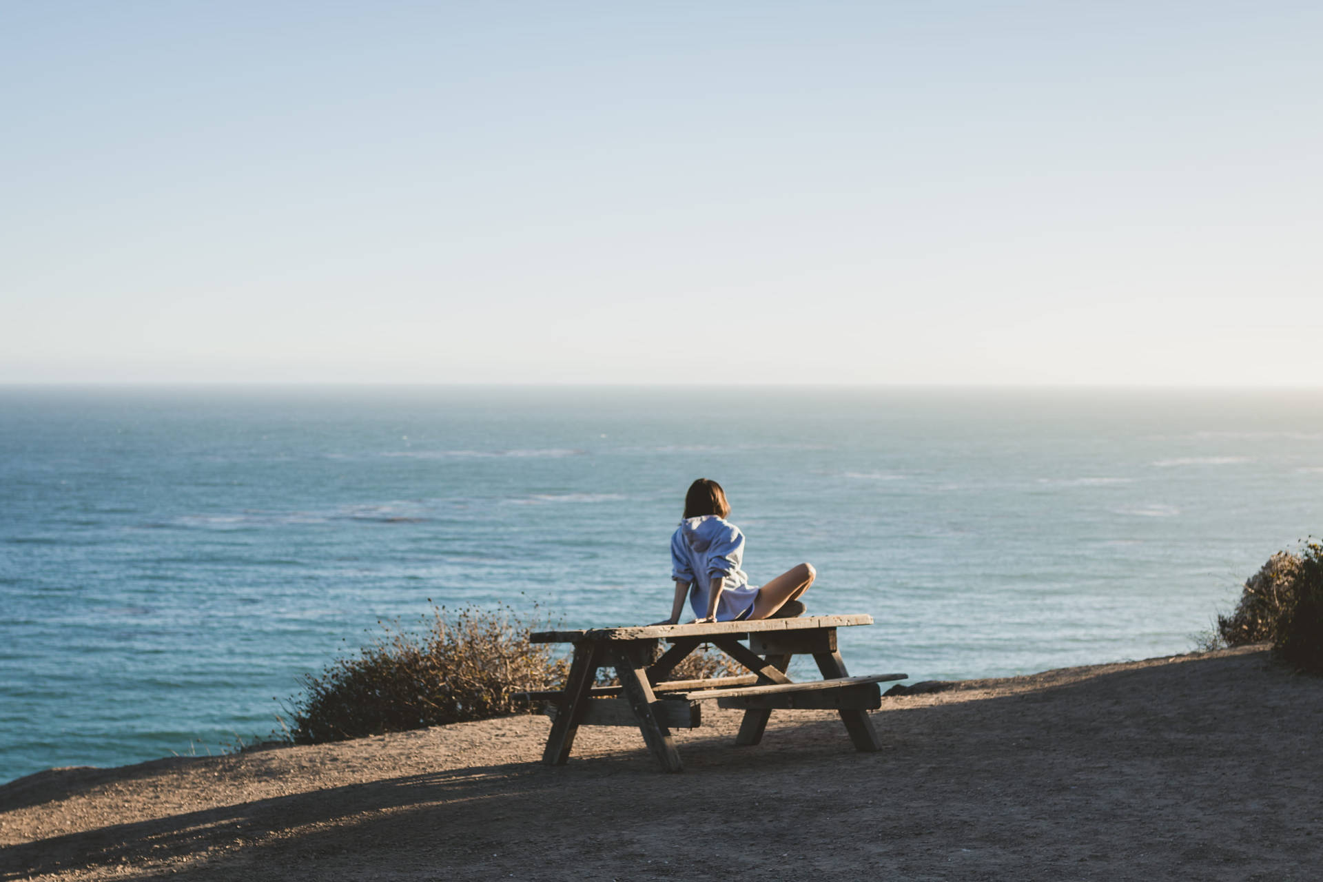 Woman On Malibu Beach Picnic Table Background