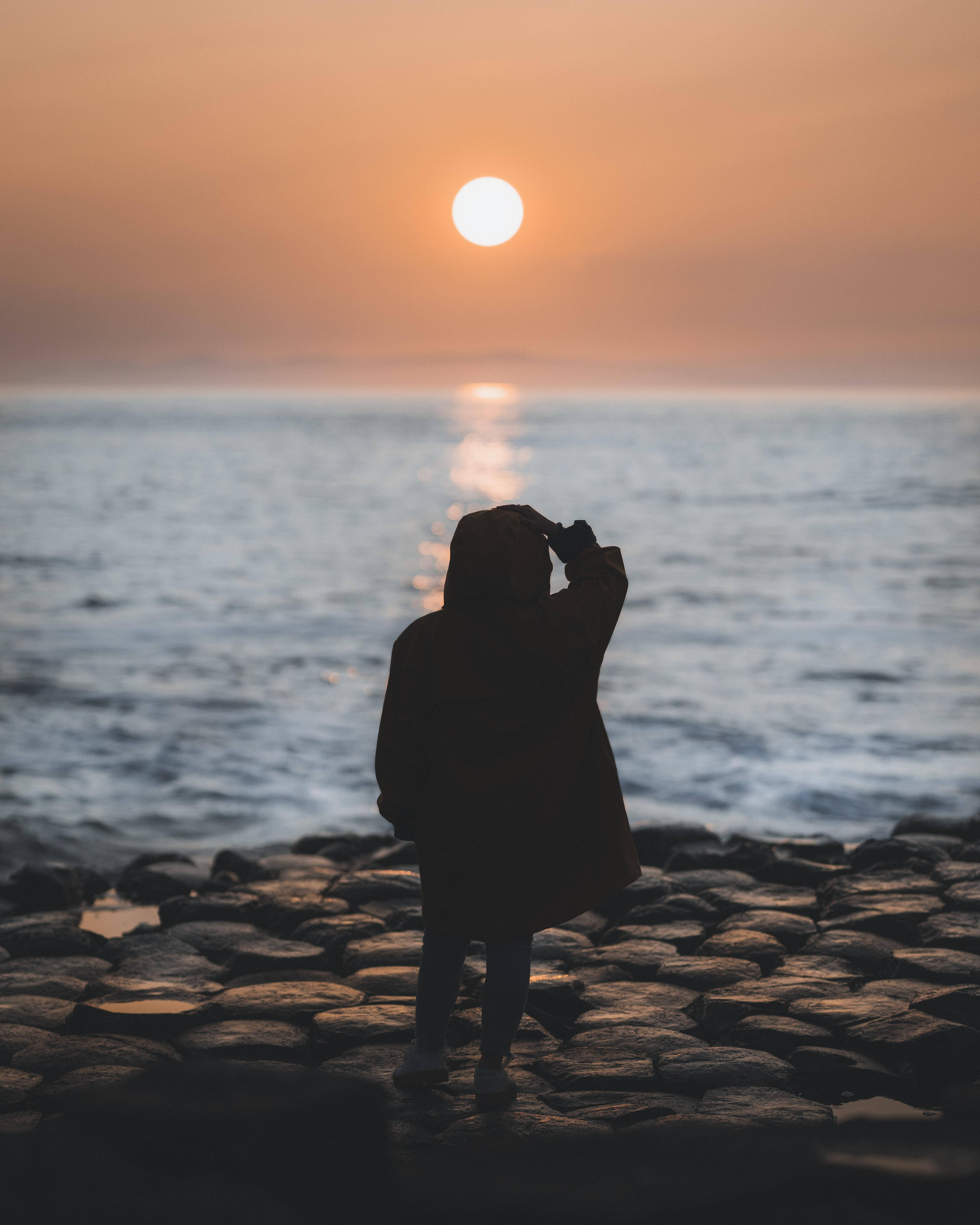 Woman On Rocky Beach Alone Phone