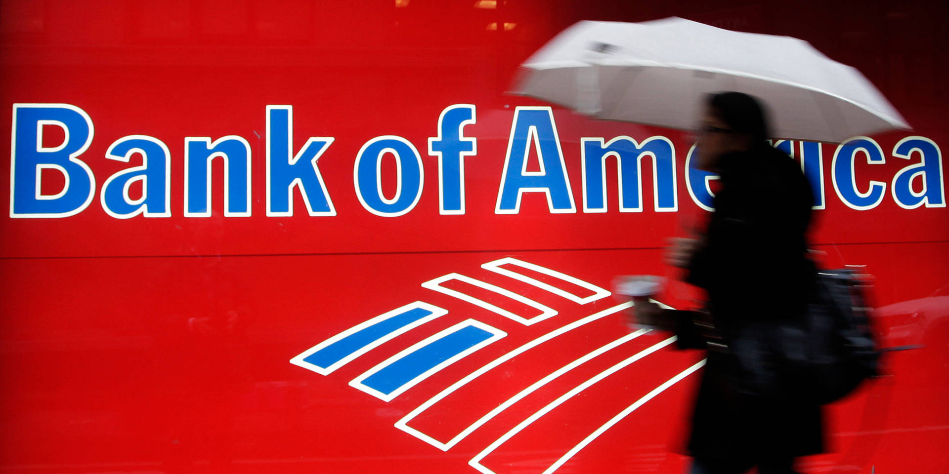 Woman Passing Bank Of America Signage
