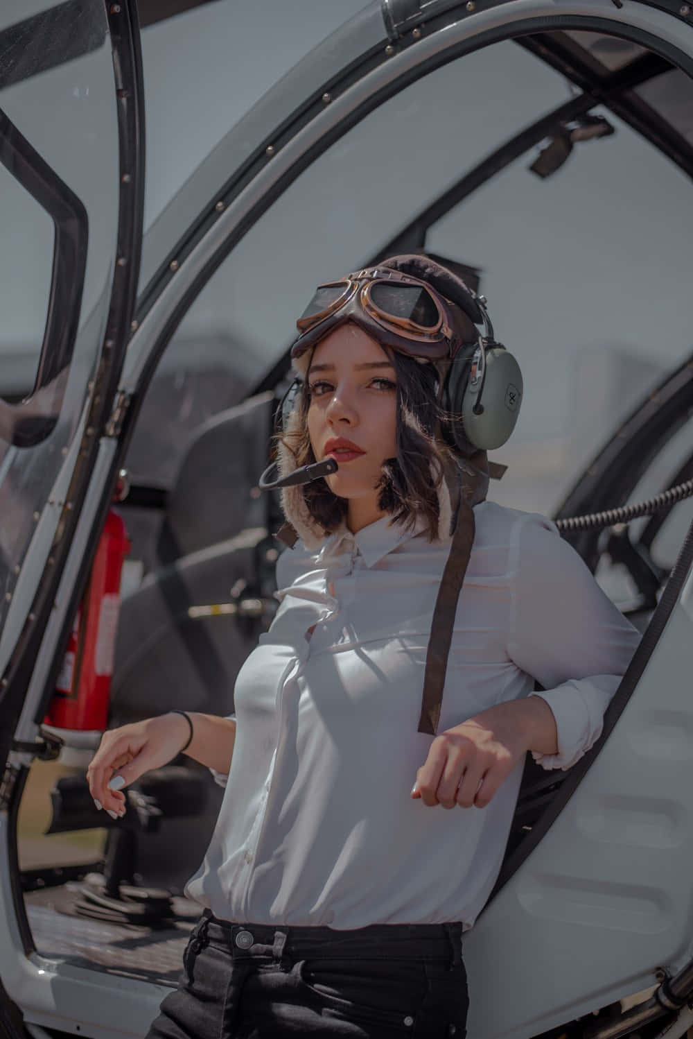 Woman Pilot Beside Cockpit Background