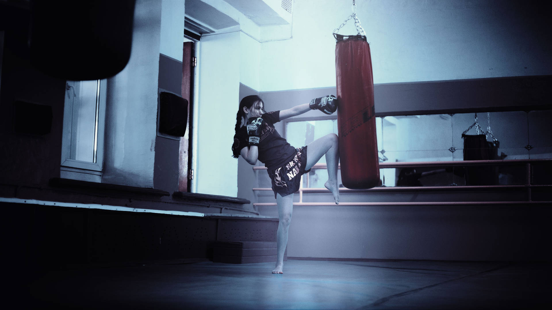 Woman Practicing Muay Thai Background