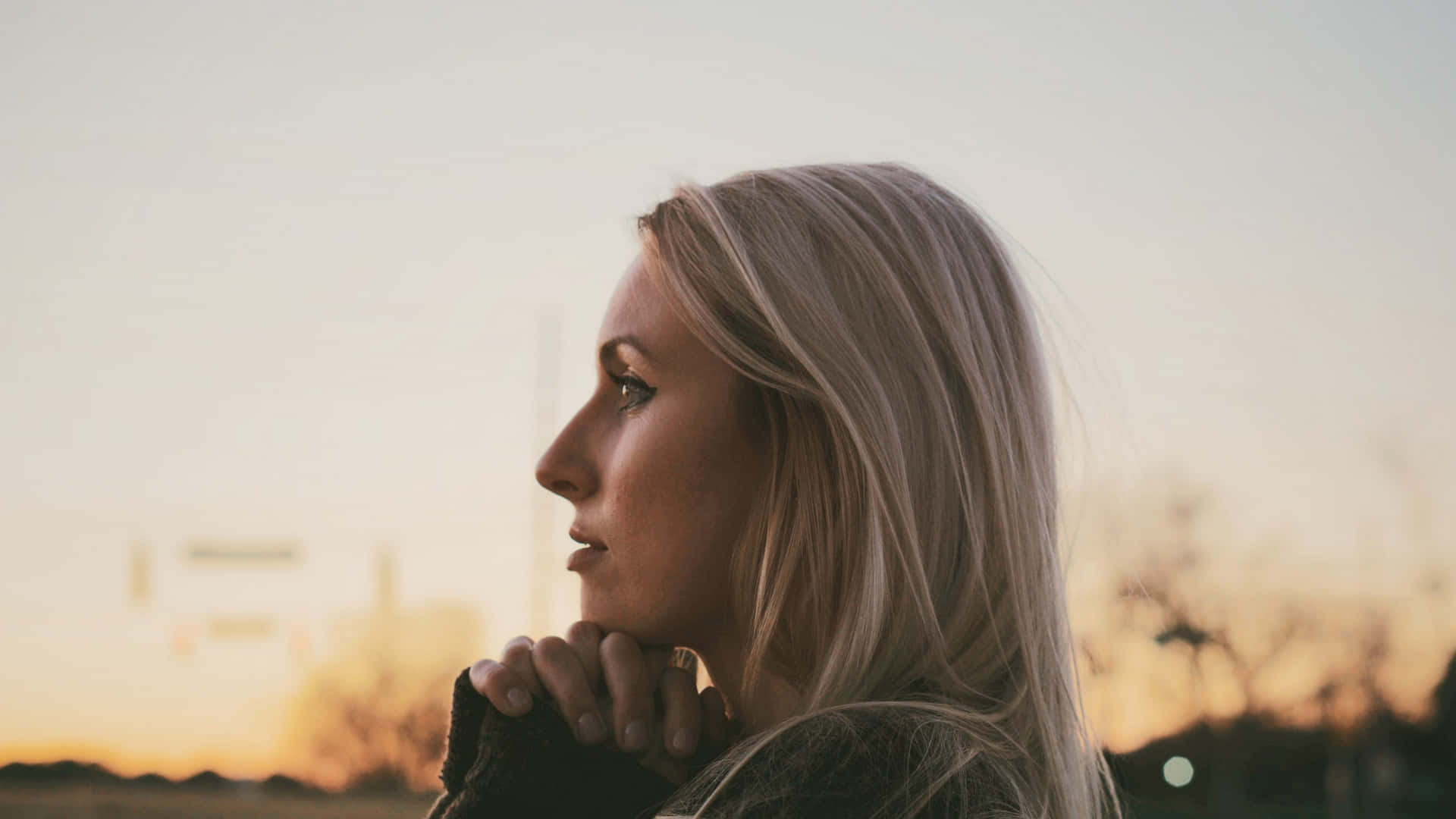 Woman Praying Headshot During Sunset