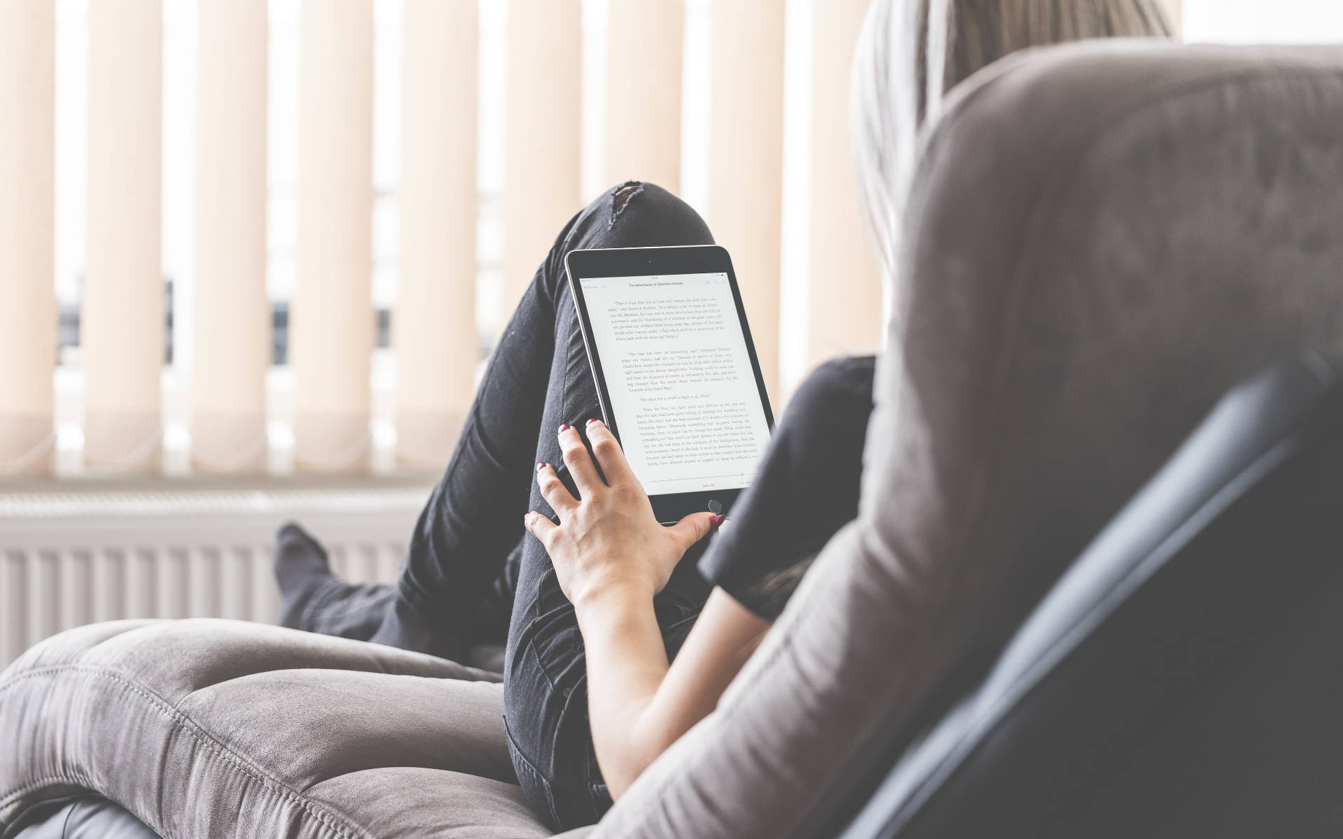 Woman Reading Ebook On Tablet