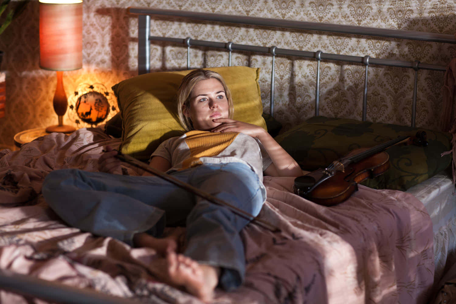 Woman Relaxingwith Violinin Bedroom