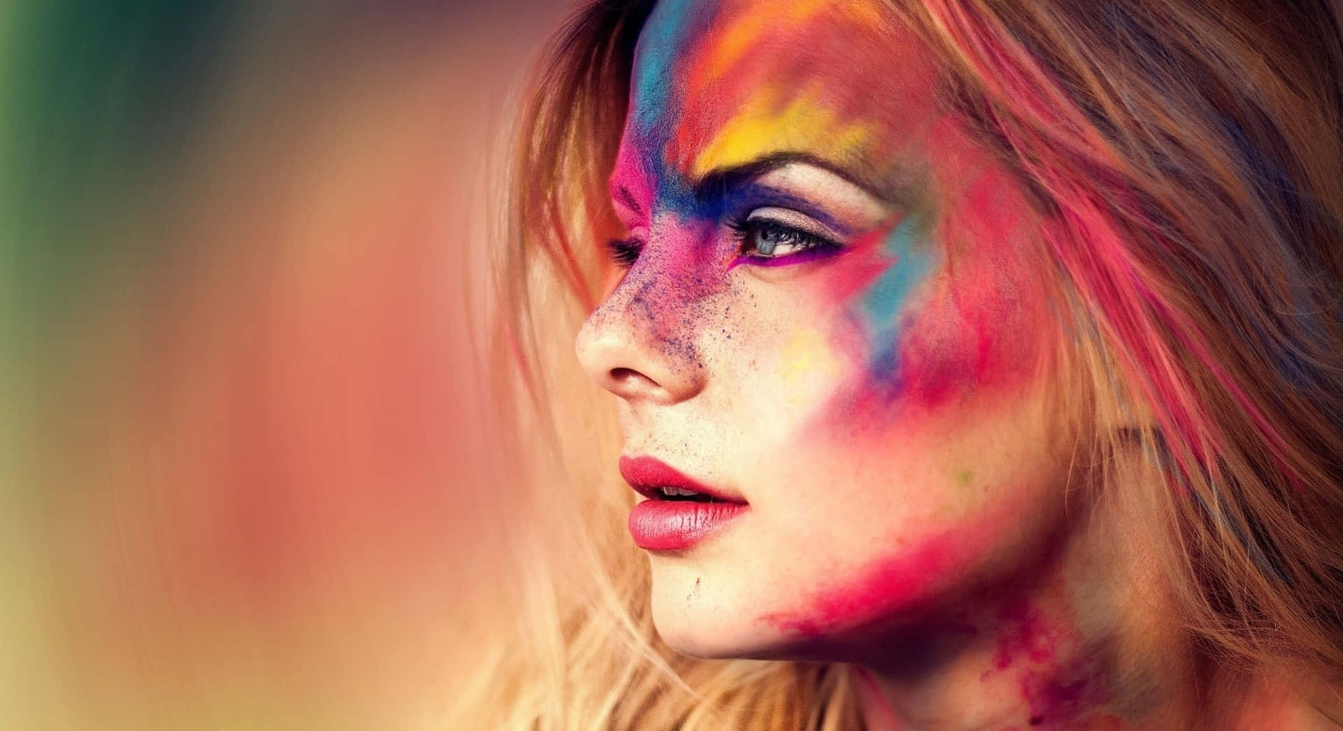 Woman Side Profile With Colorful Face Paint Background