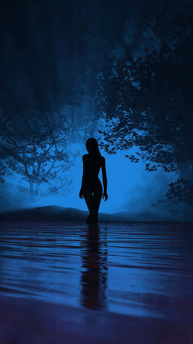 Woman Silhouette In Blue Background