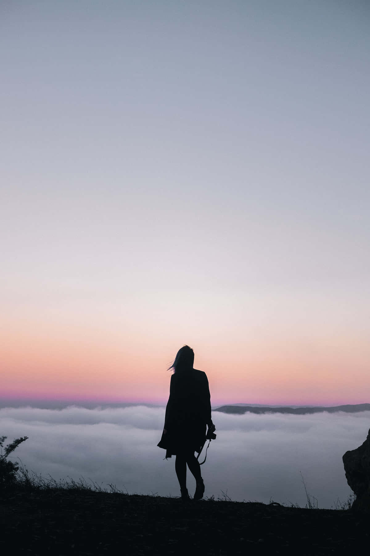 Woman Silhouette On Mountain Background