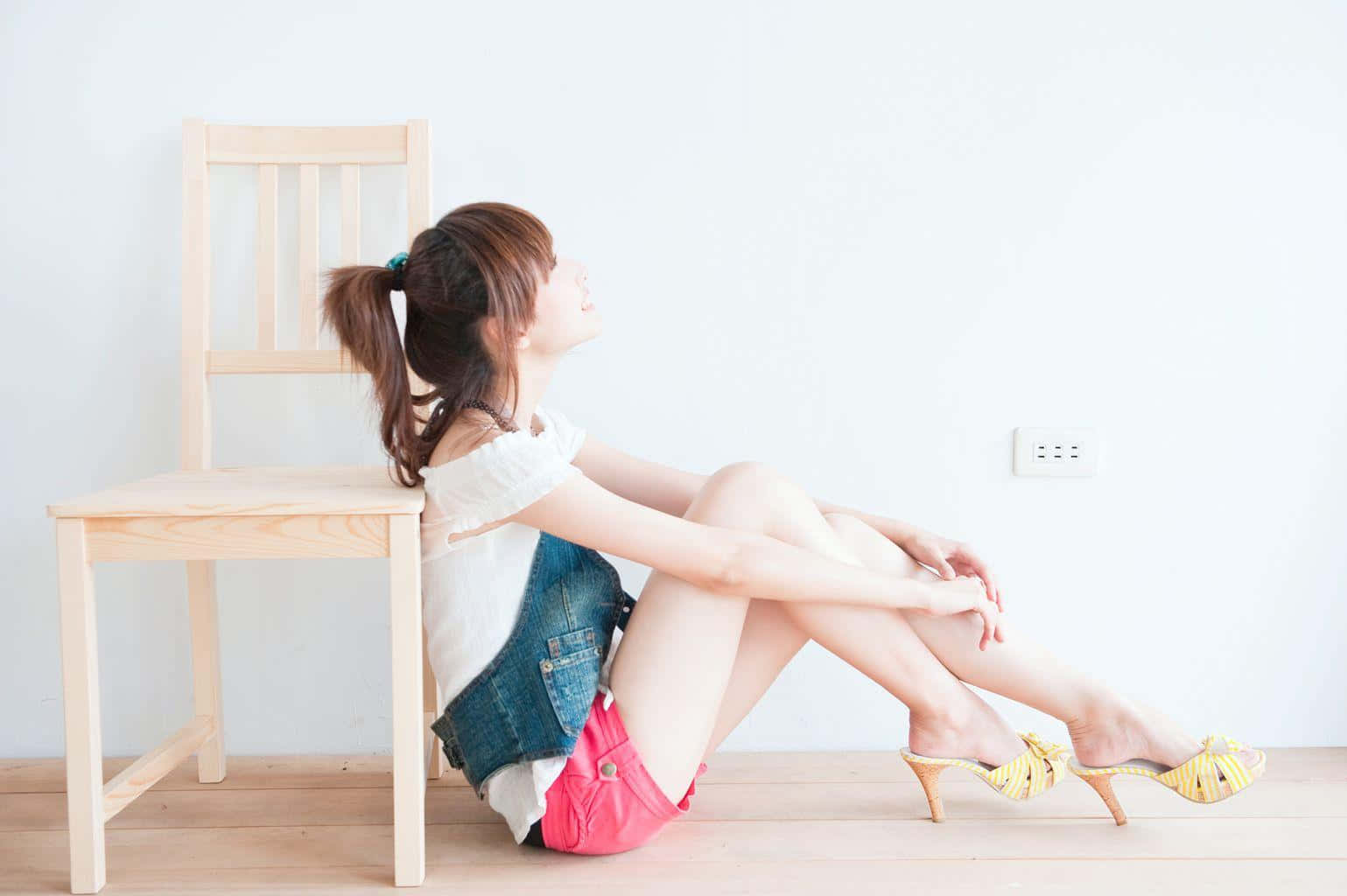 Woman Sitting Beside Chair Bare Legs Background