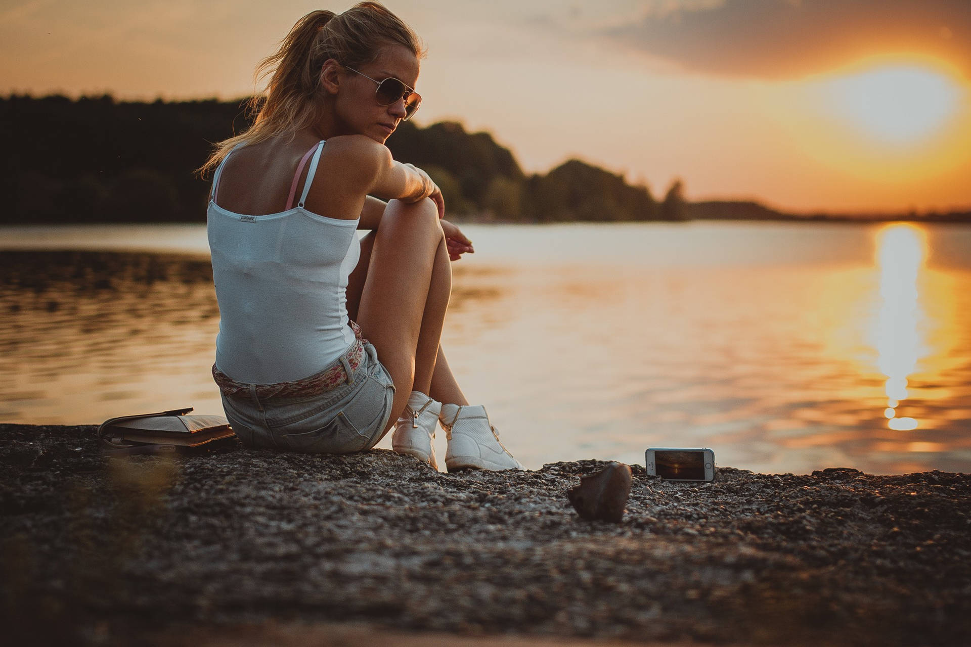 Woman Sitting On The Riverside