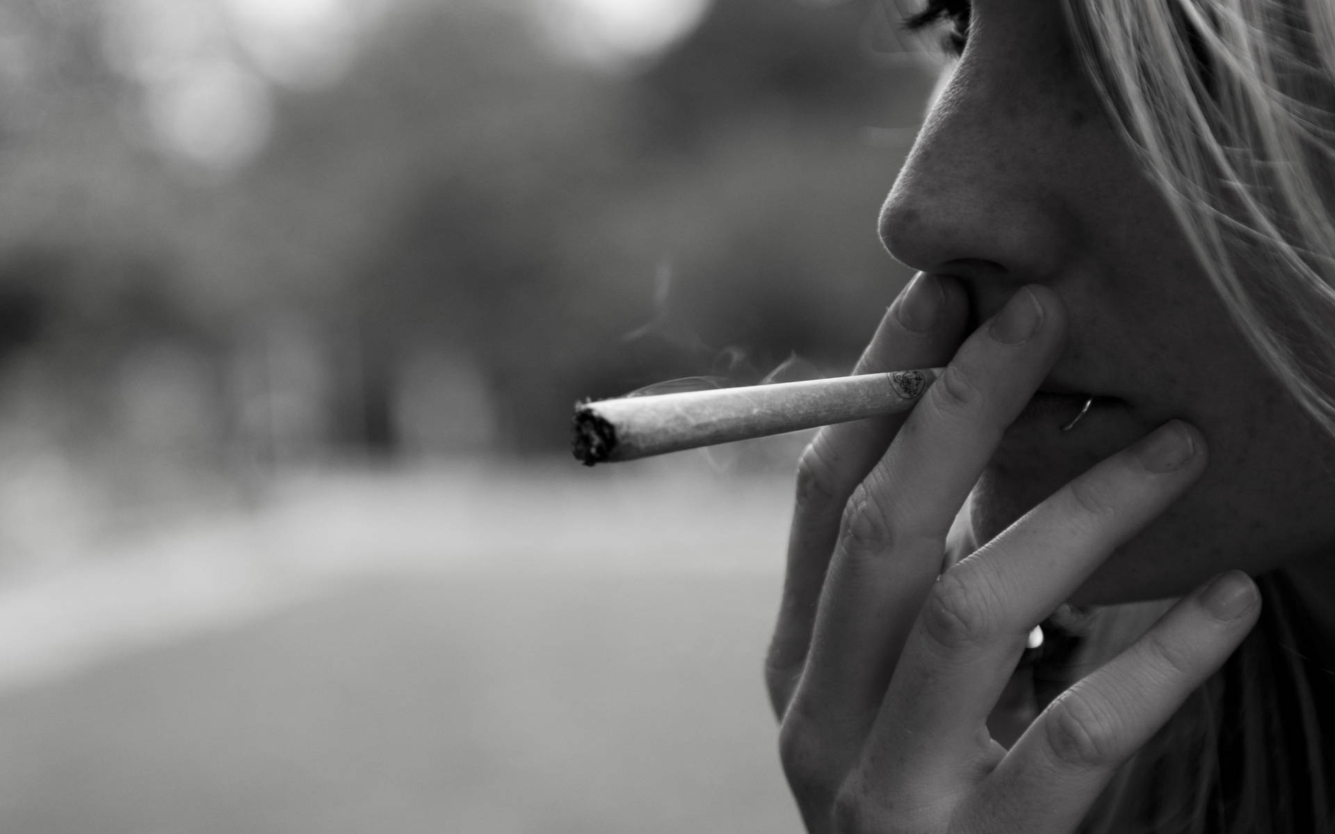 Woman Smoking Weed Close-up Background