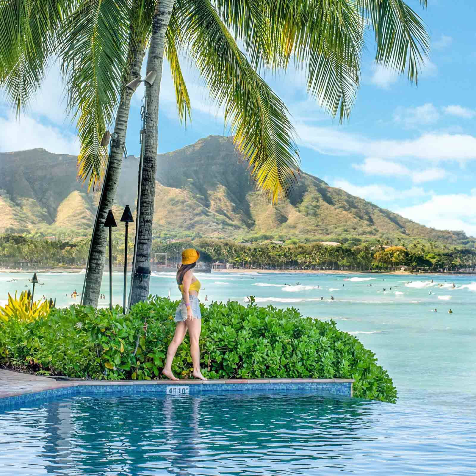 Woman Standing By Pool In Oahu