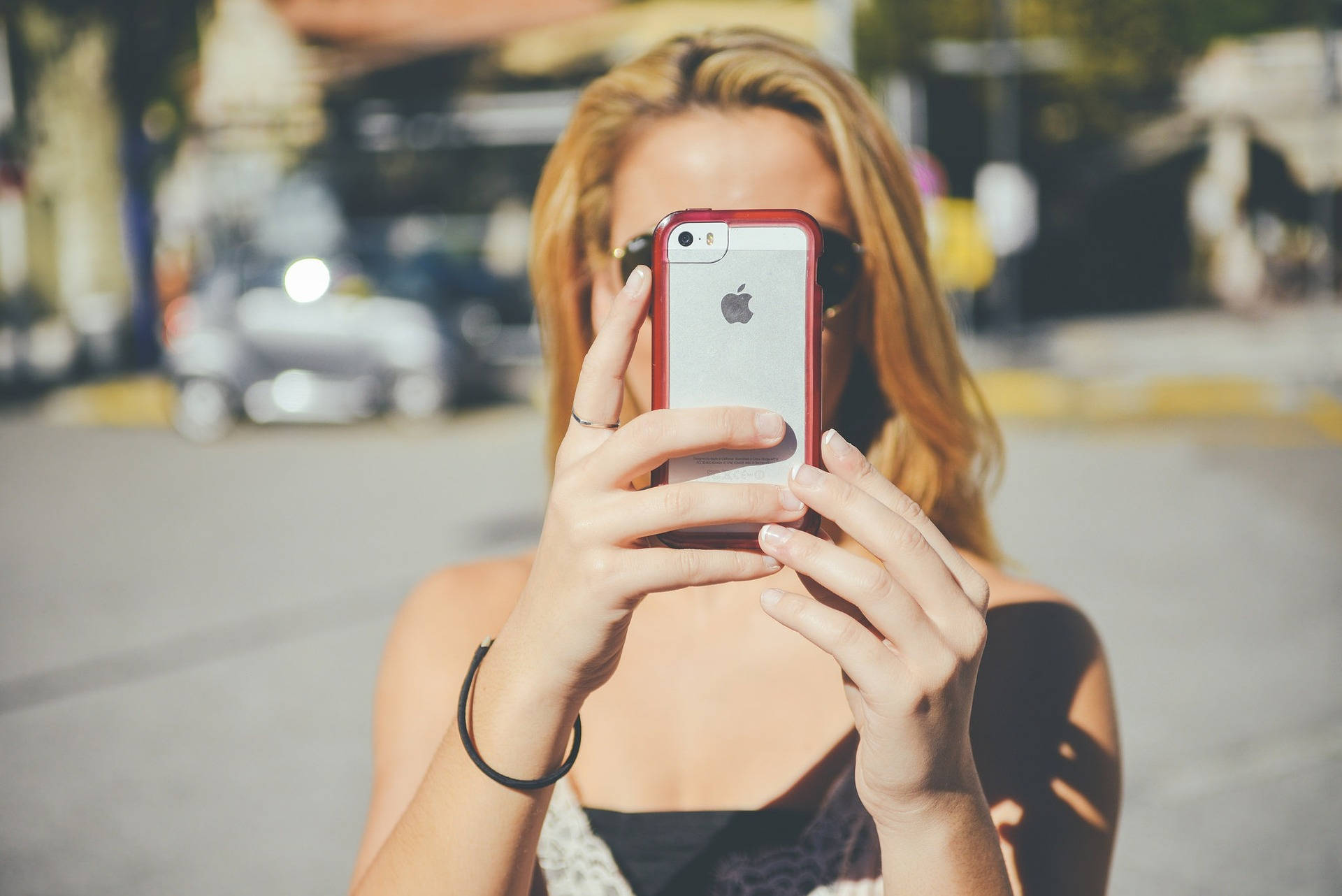 Woman Taking Photo Using Mobile Phone Background