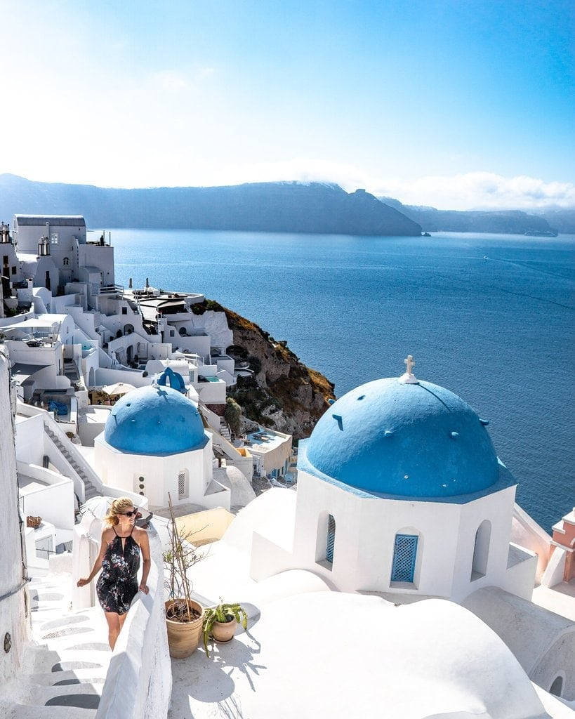 Woman Tourist In Santorini Background