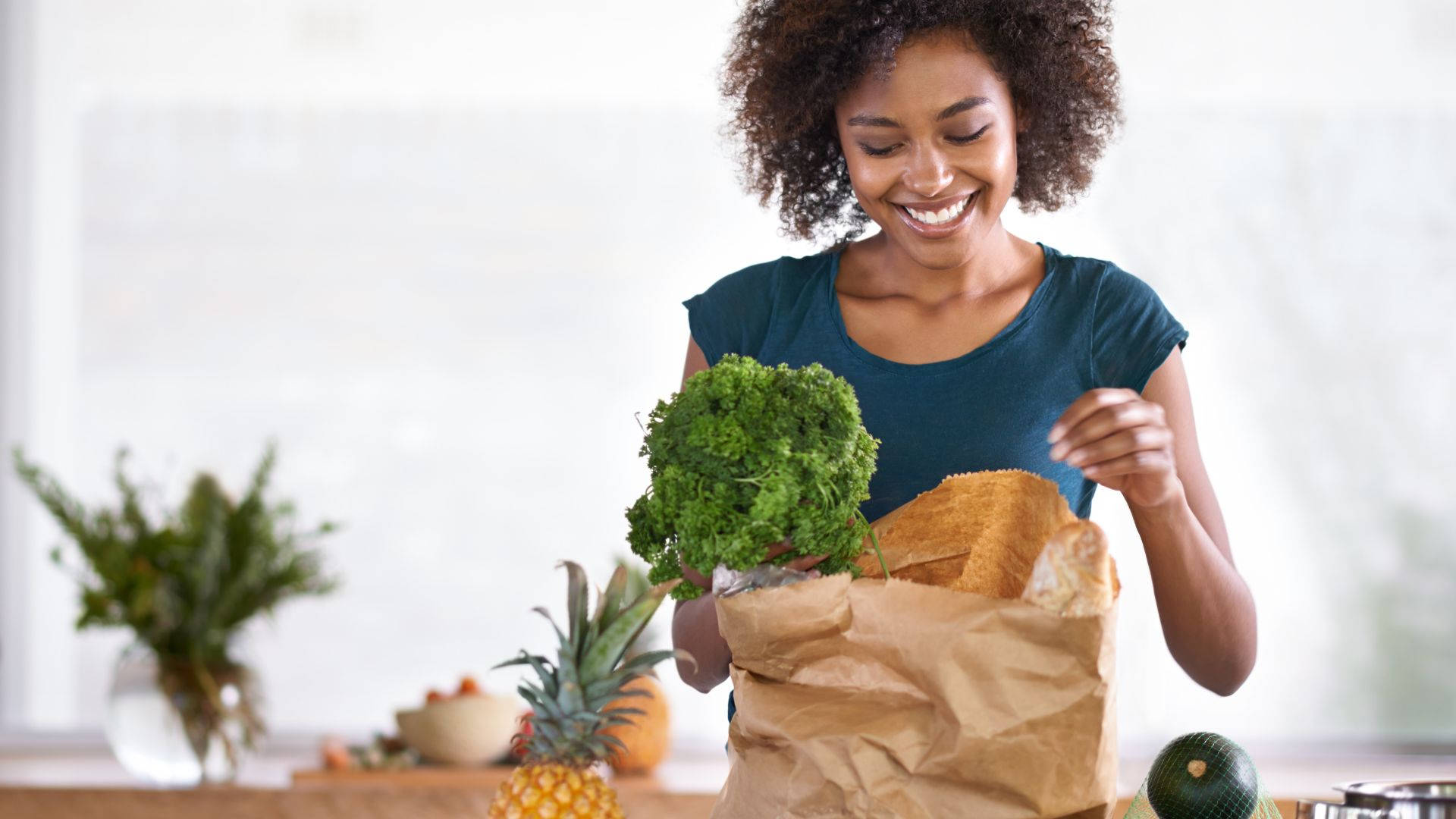 Woman Unpacking Grocery Items Background