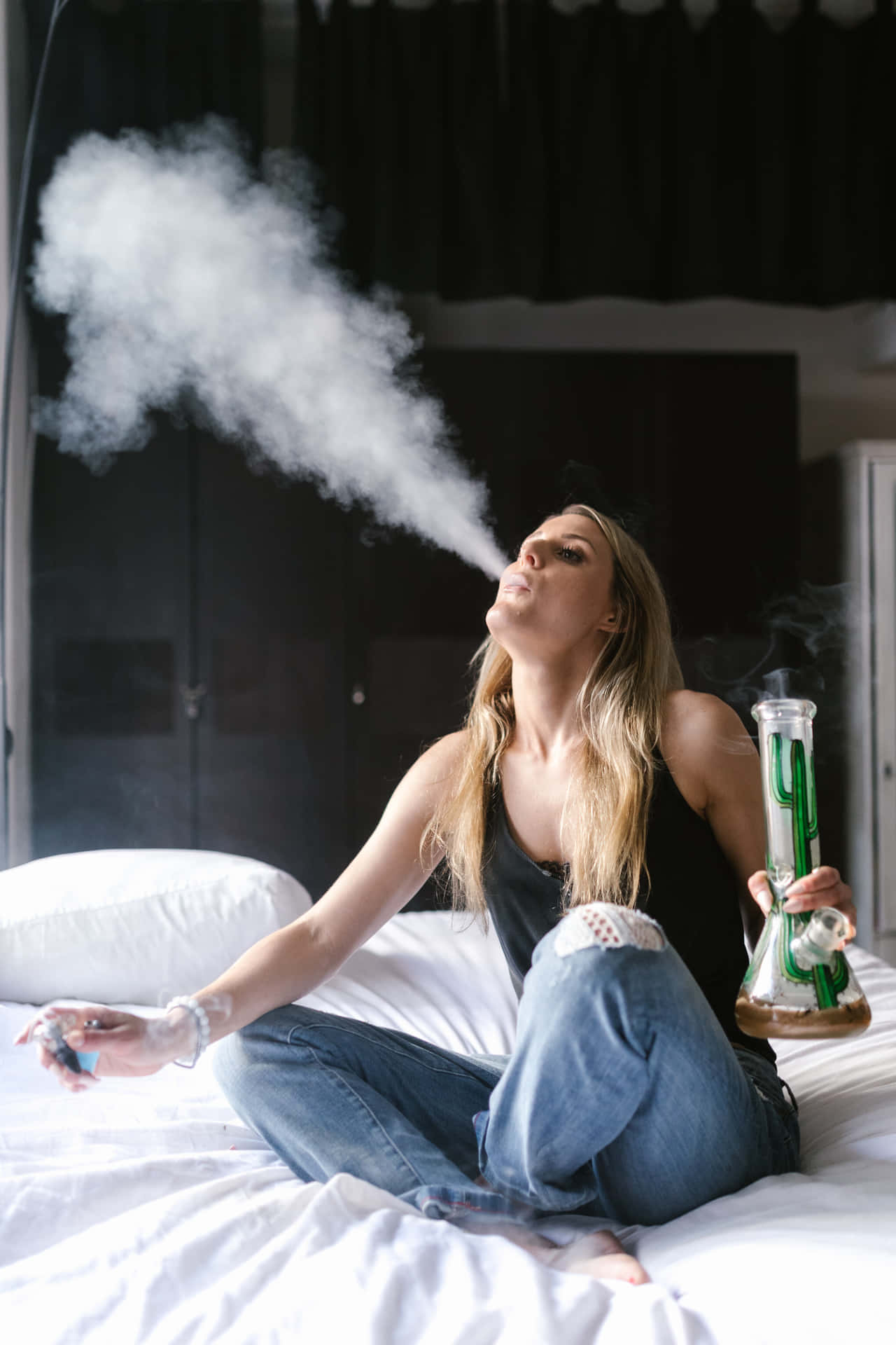 Woman Using A Bong With A Joint Background