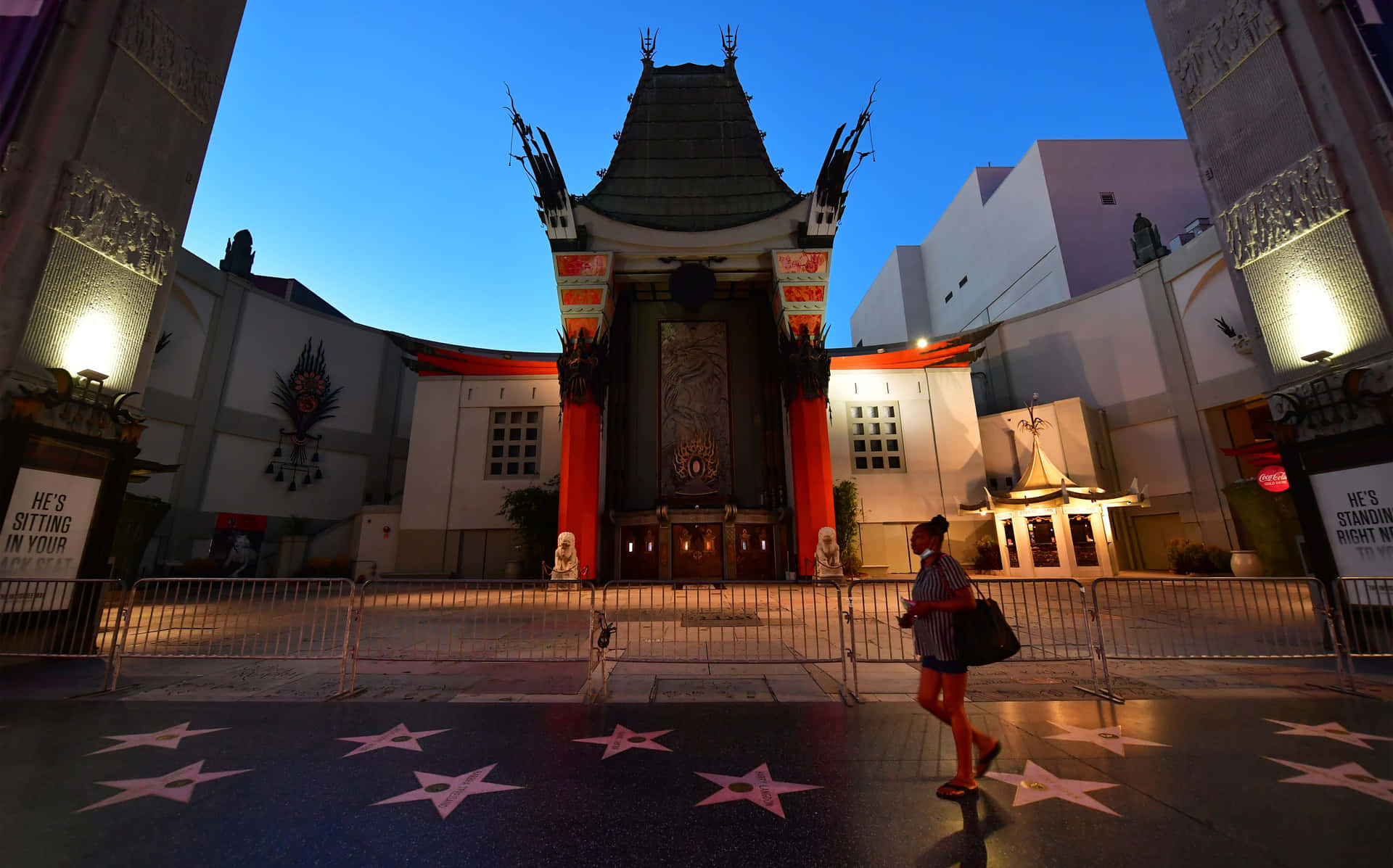 Woman Walking Outside Graumans Chinese Theatre Background