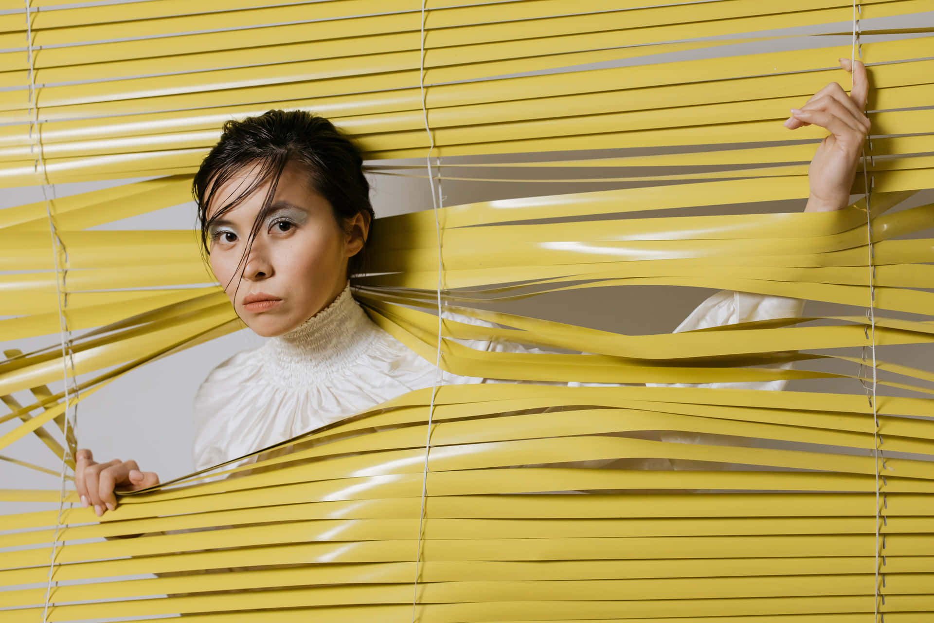 Woman Walking Through Sunshine Blinds Background