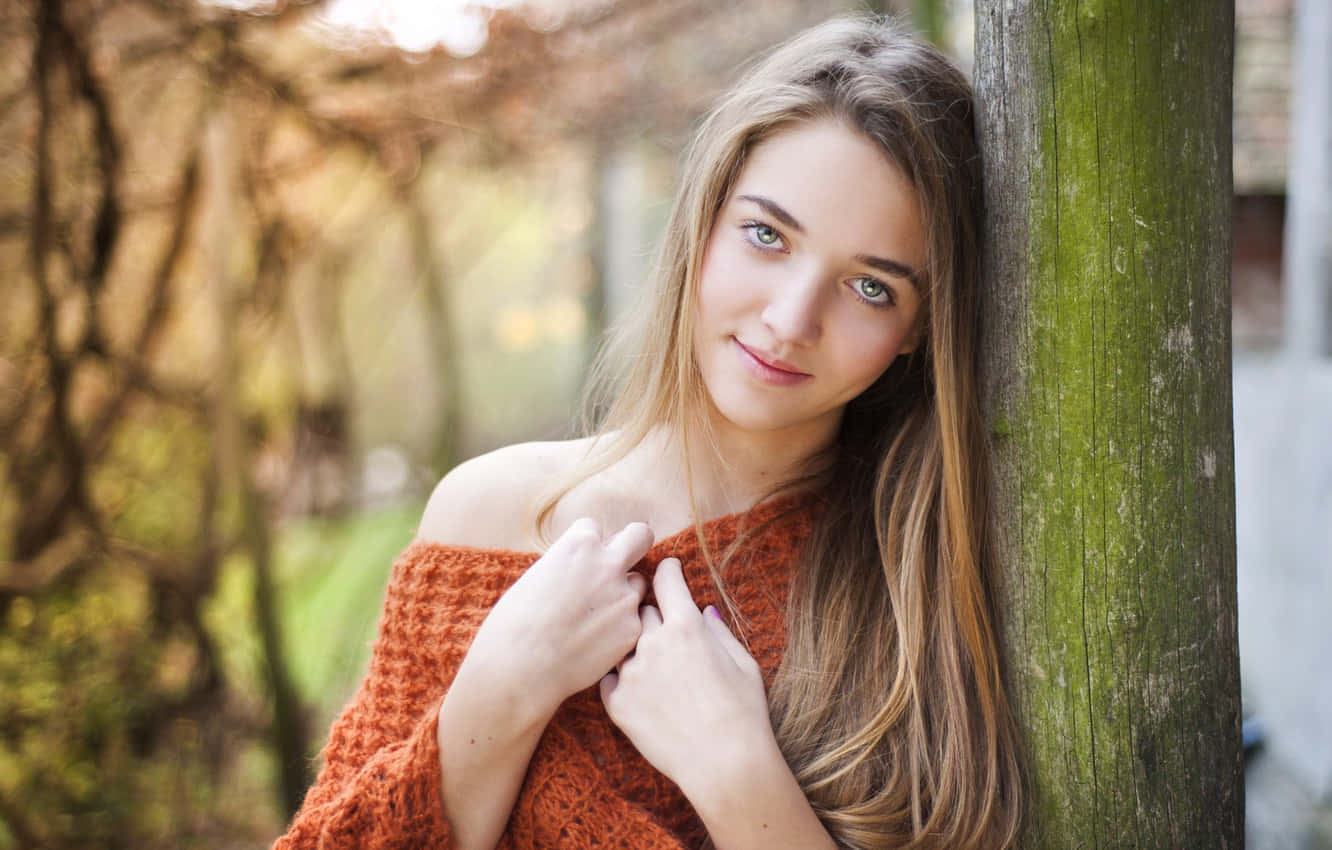 Woman Wearing An Orange Off Shoulder Knit Sweater Background