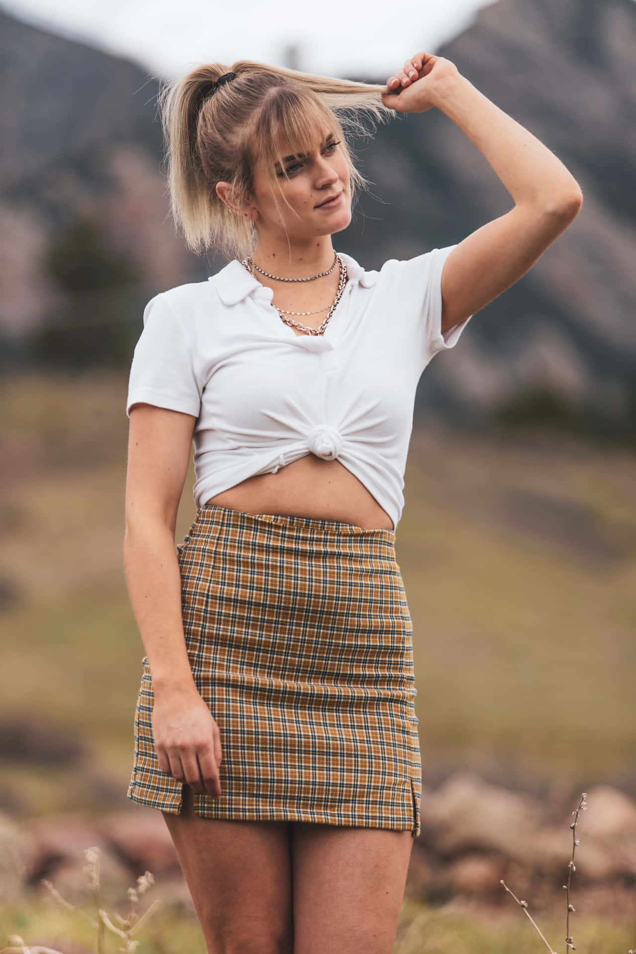 Woman Wearing Caramel Pleated Miniskirt Background