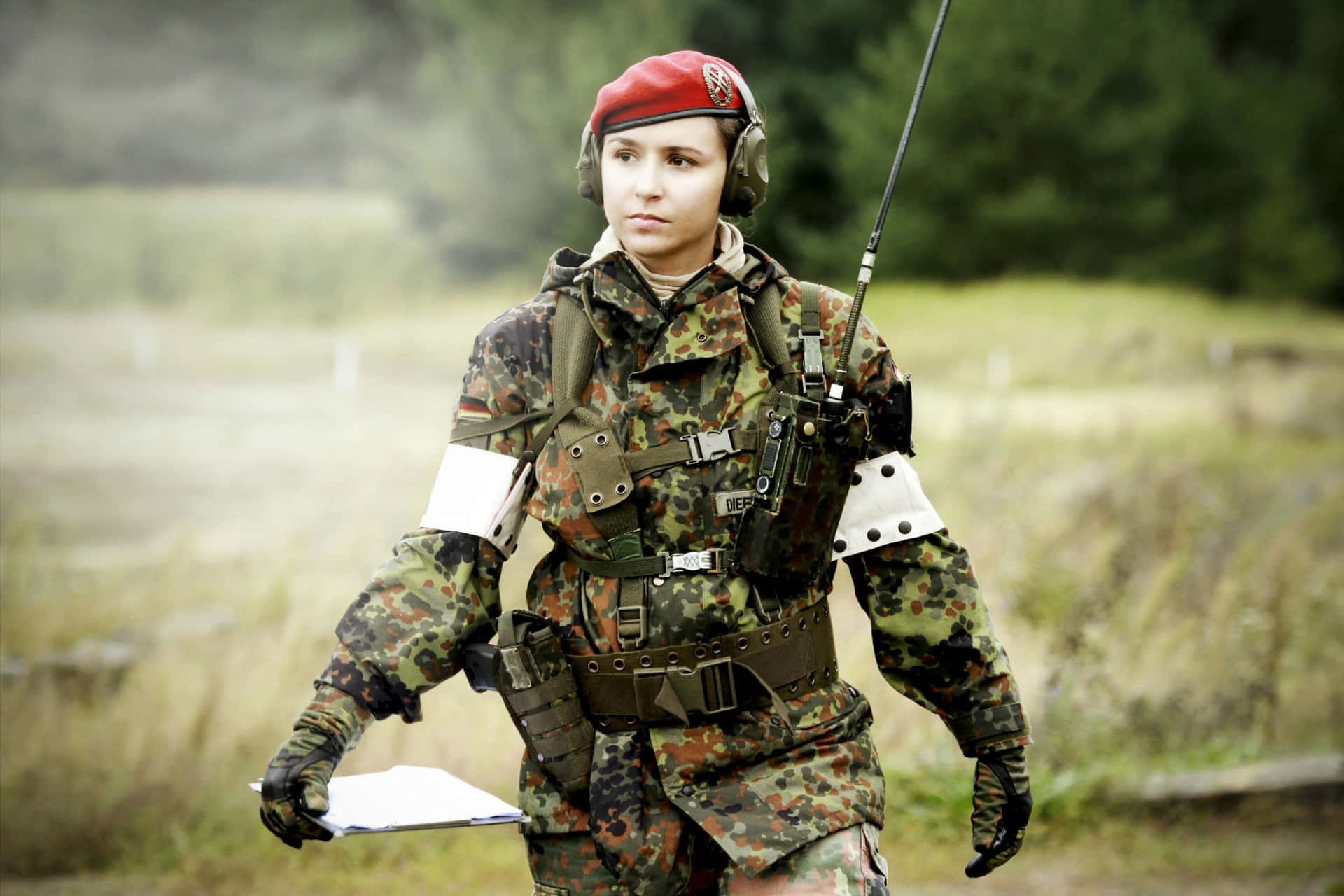 Woman Wearing Uniform On Field Background