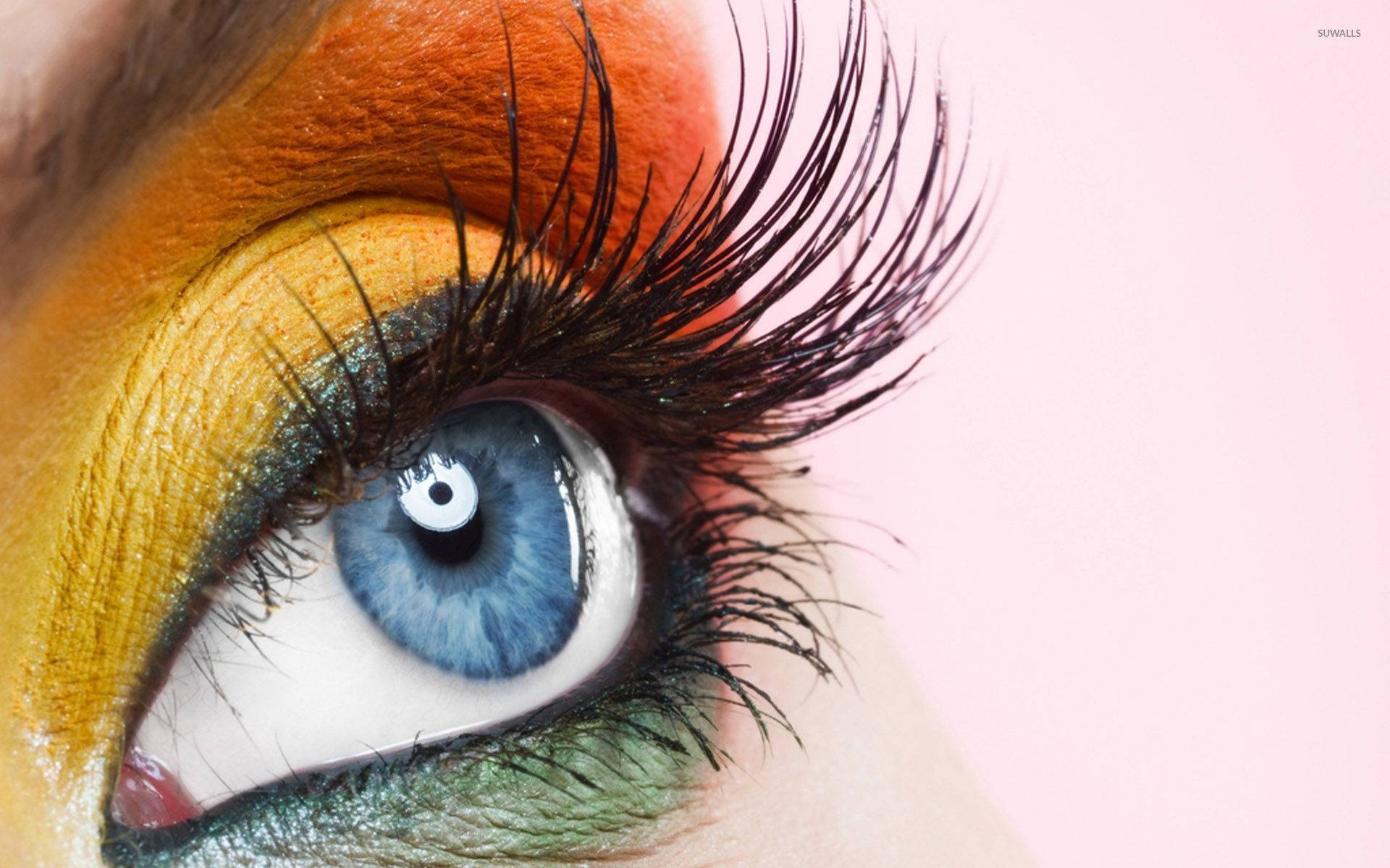 Woman With Orange And Yellow Eye Makeup Background