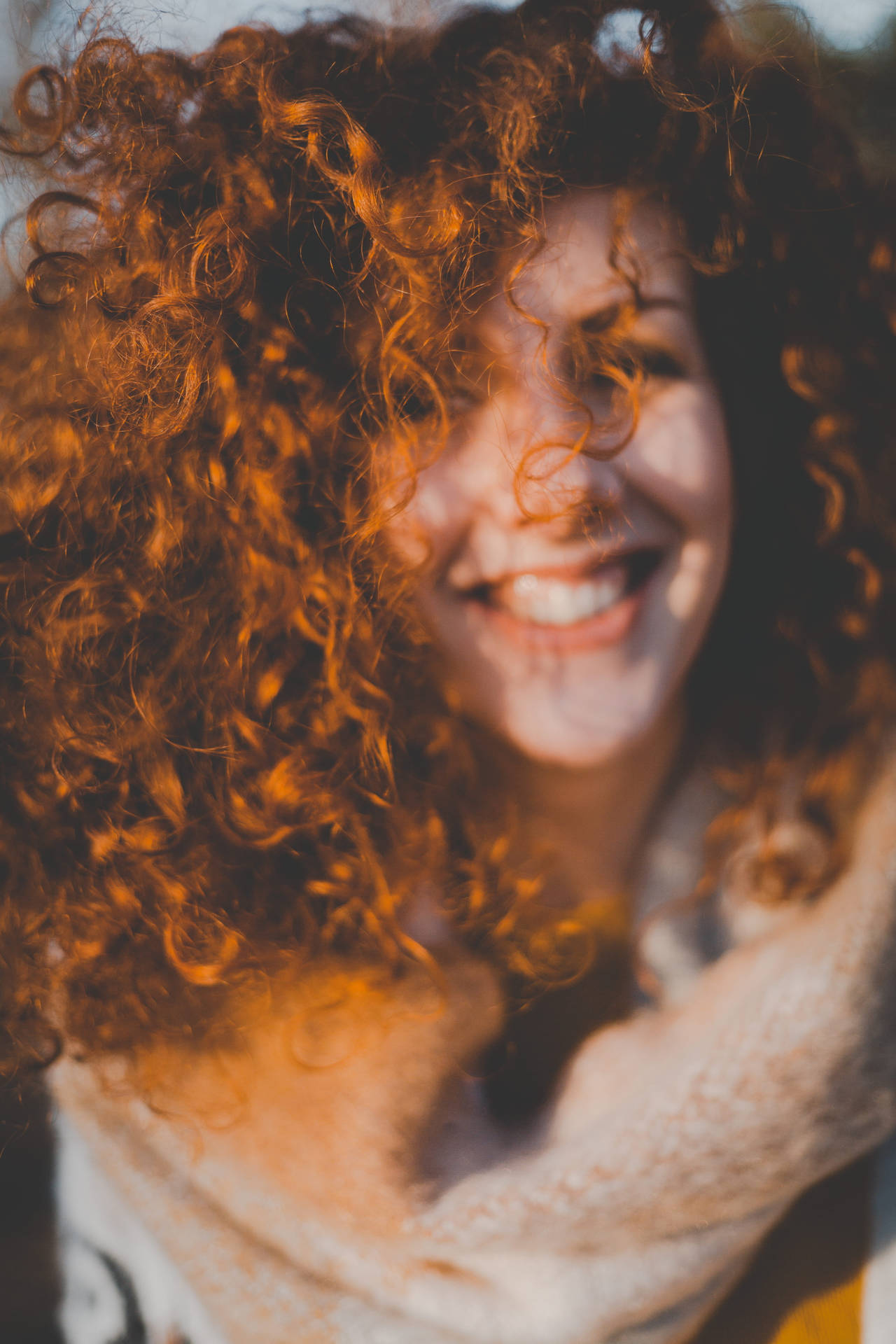 Woman With Orange Curly Hair Background