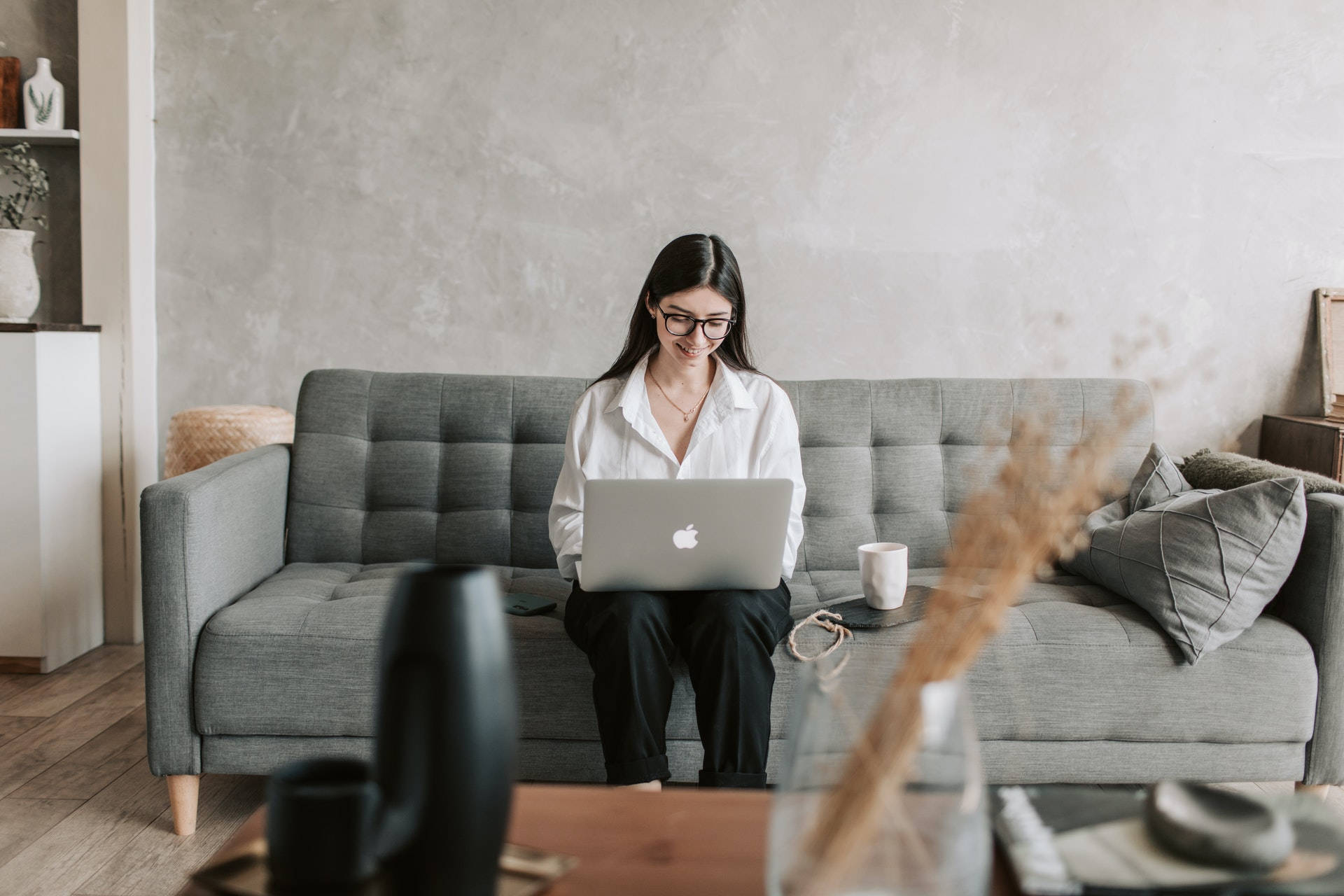 Woman Workingon Laptopat Home Background