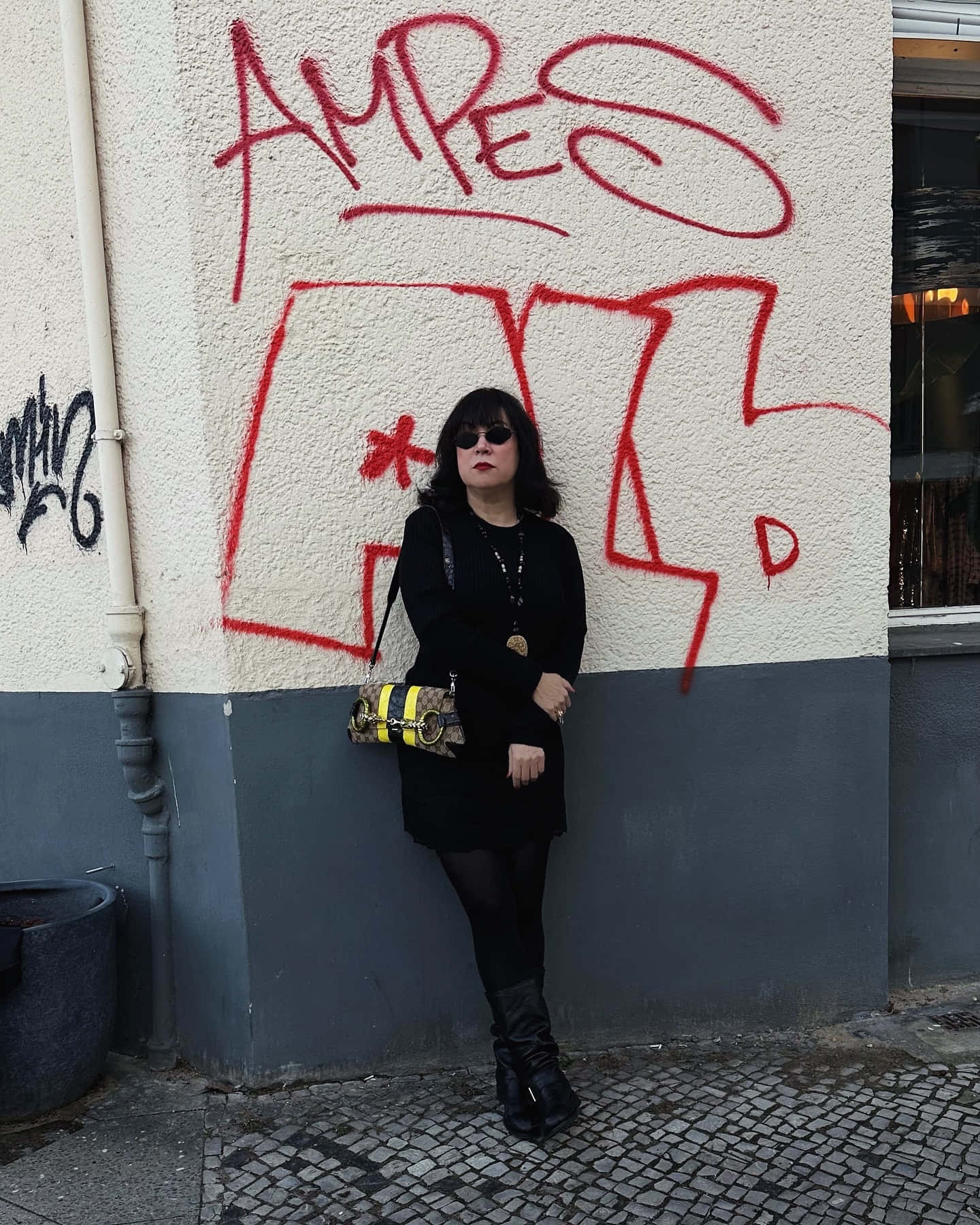 Womanin Black Against Graffiti Wall