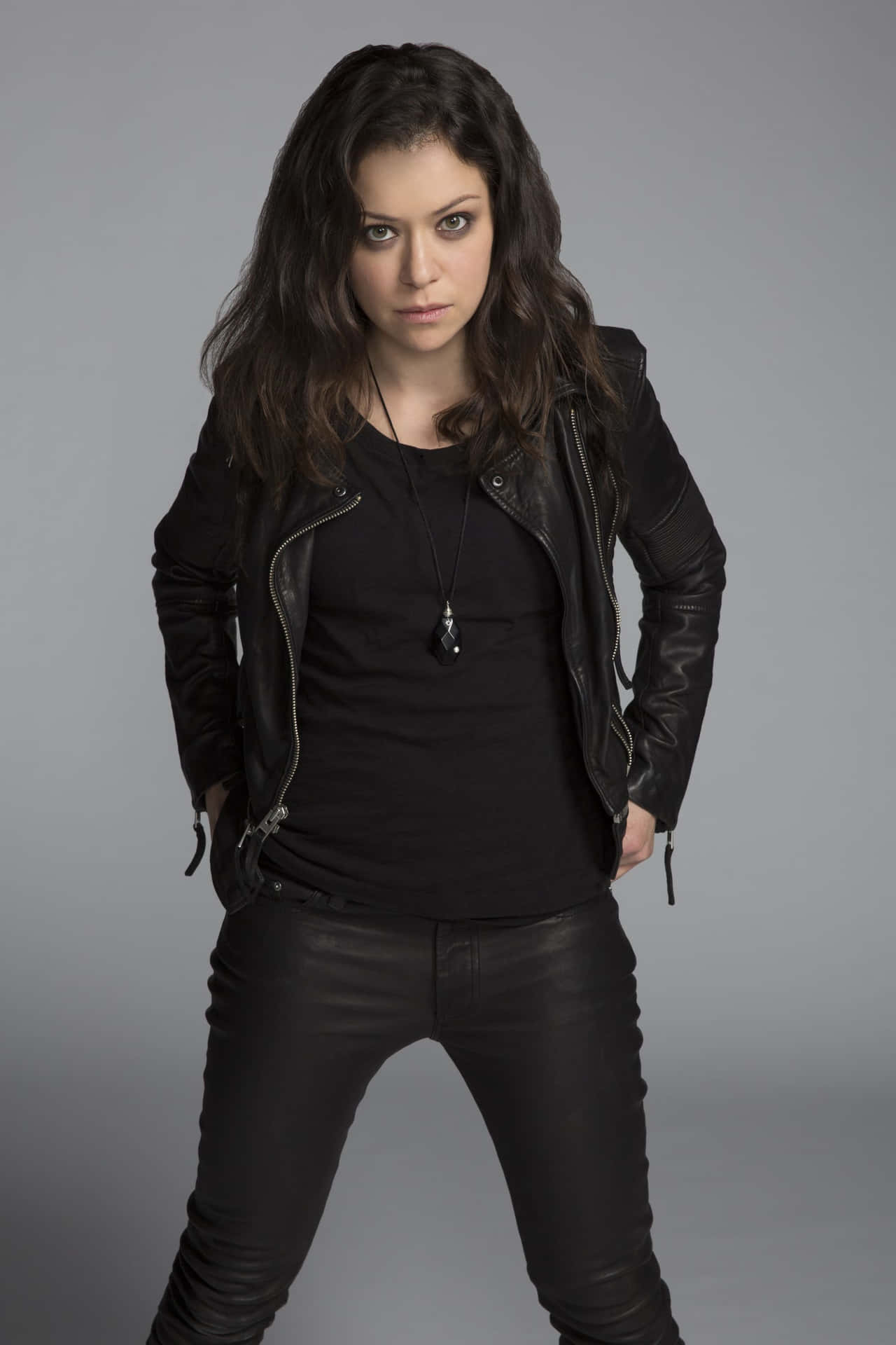 Womanin Black Leather Jacketand Pants Background