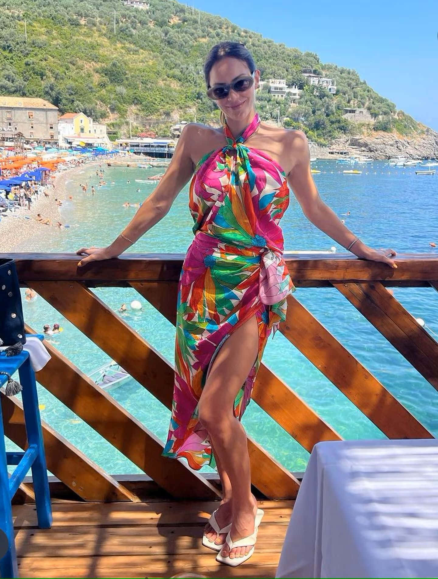 Womanin Colorful Dressat Beachside Background