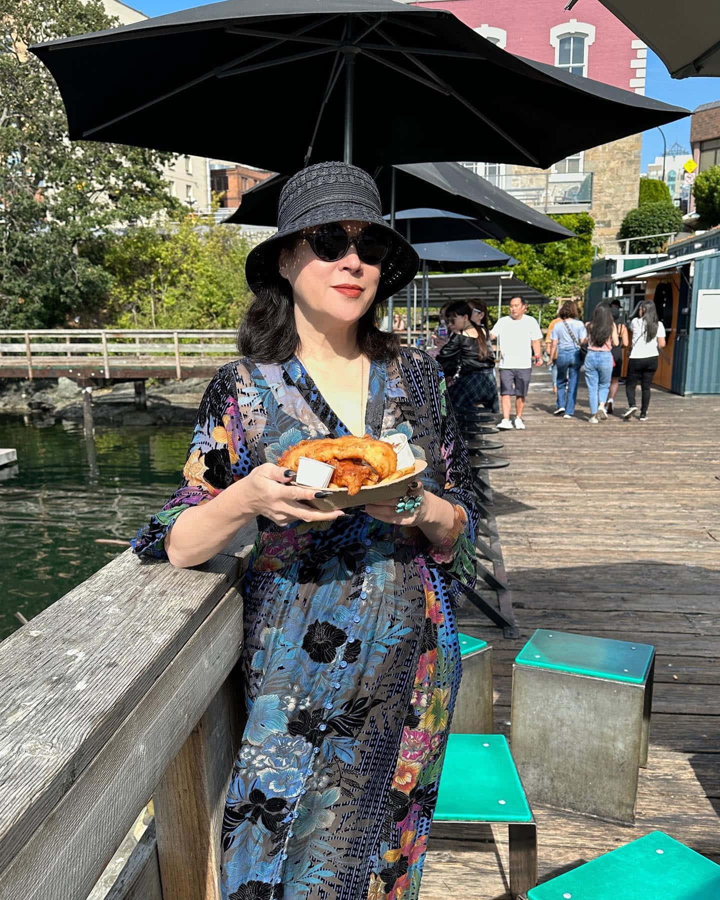 Womanwith Umbrellaand Pastry Outdoors Background