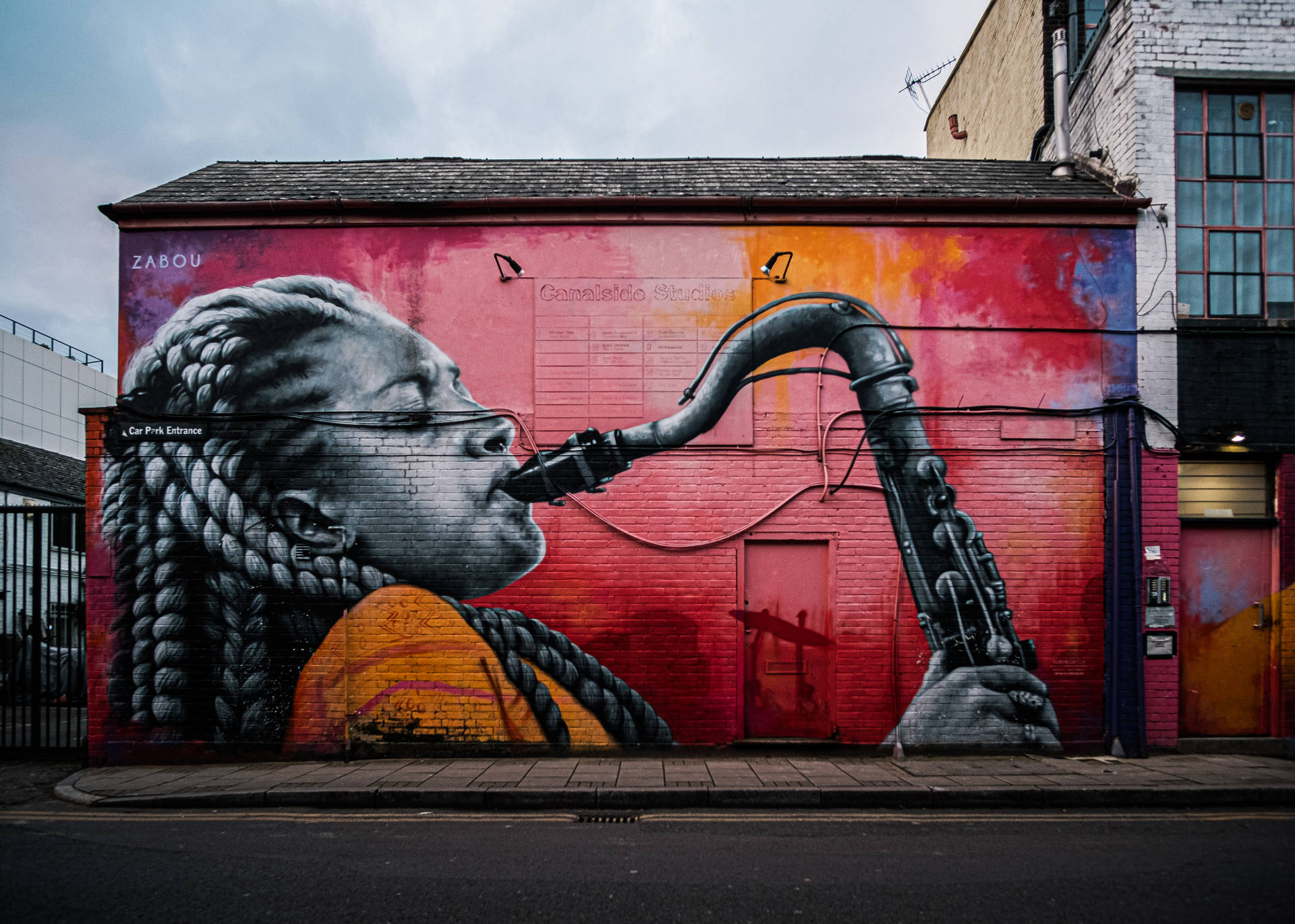 Women Playing Saxophone Street Art Background