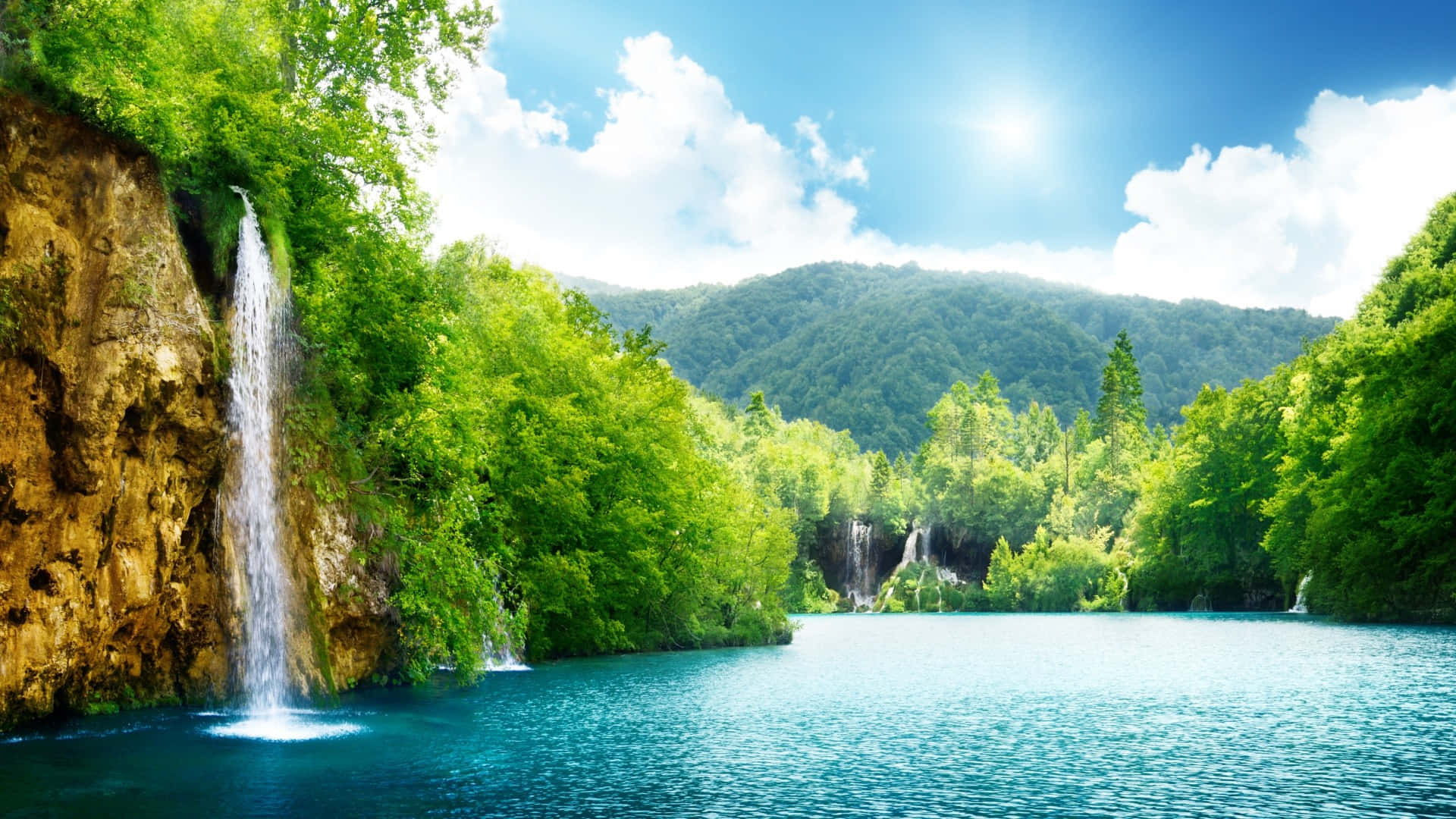 Wonderful Waterfall Near Mountains Background
