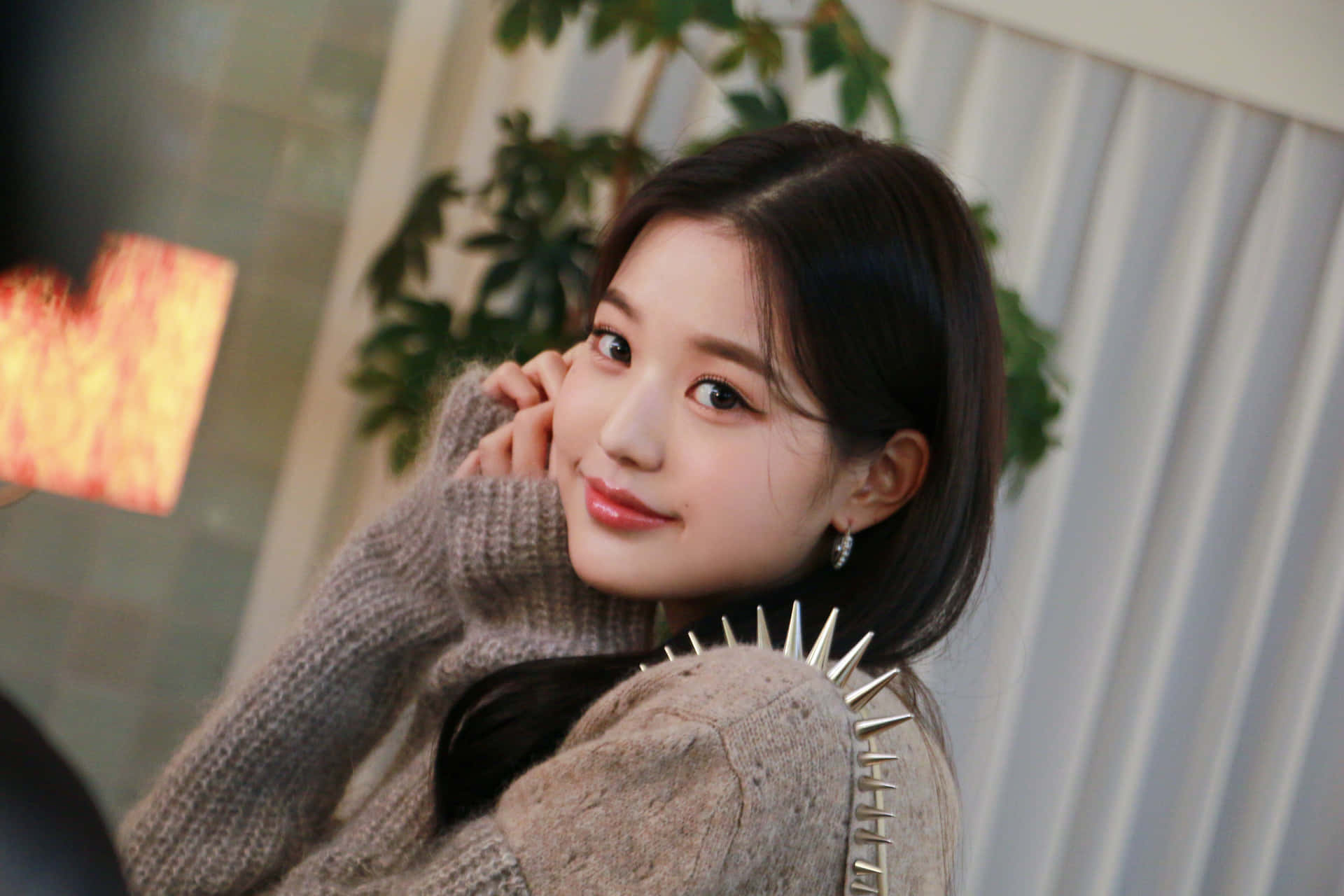 Wonyoung Adorning A Miu Miu Knit Sweater Background